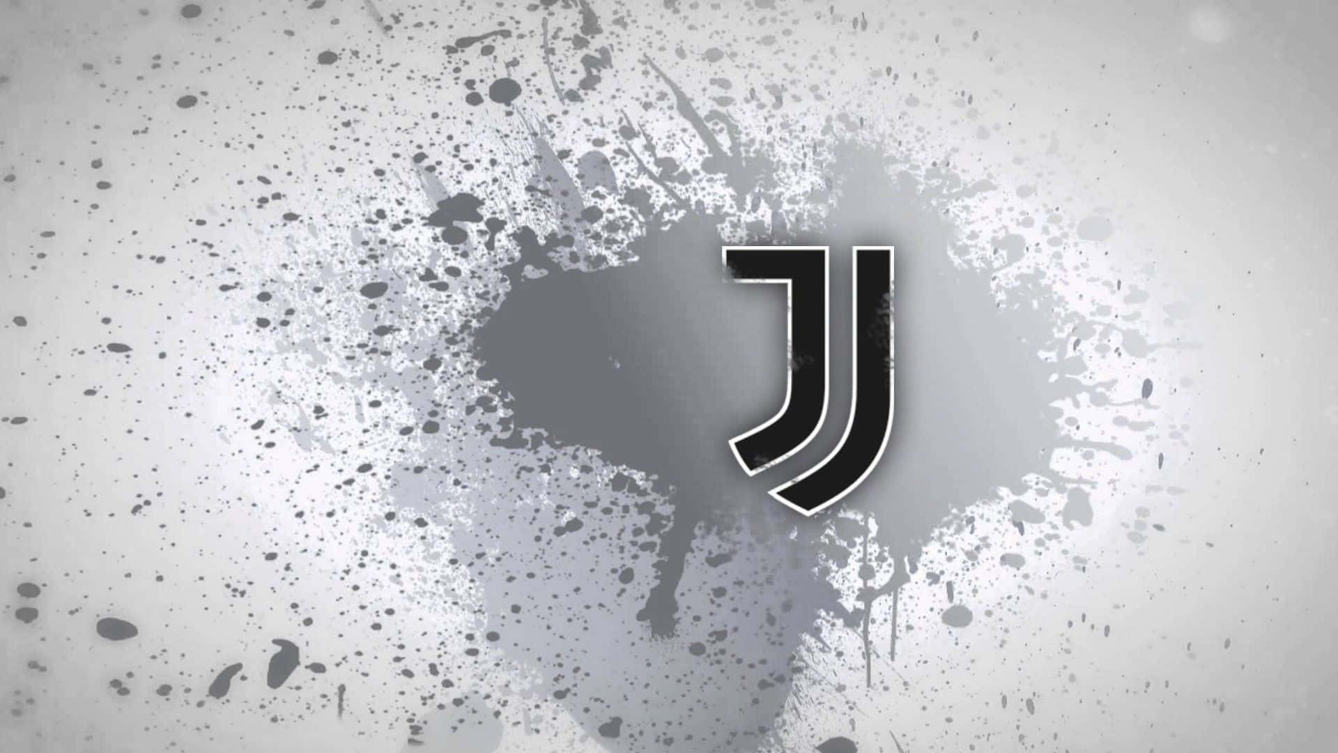 Juventus 桌布 壁紙 — 一個大膽的黑色祖雲達斯標誌居中在帶有紋理的灰色背景上，並帶有墨水飛濺效果。