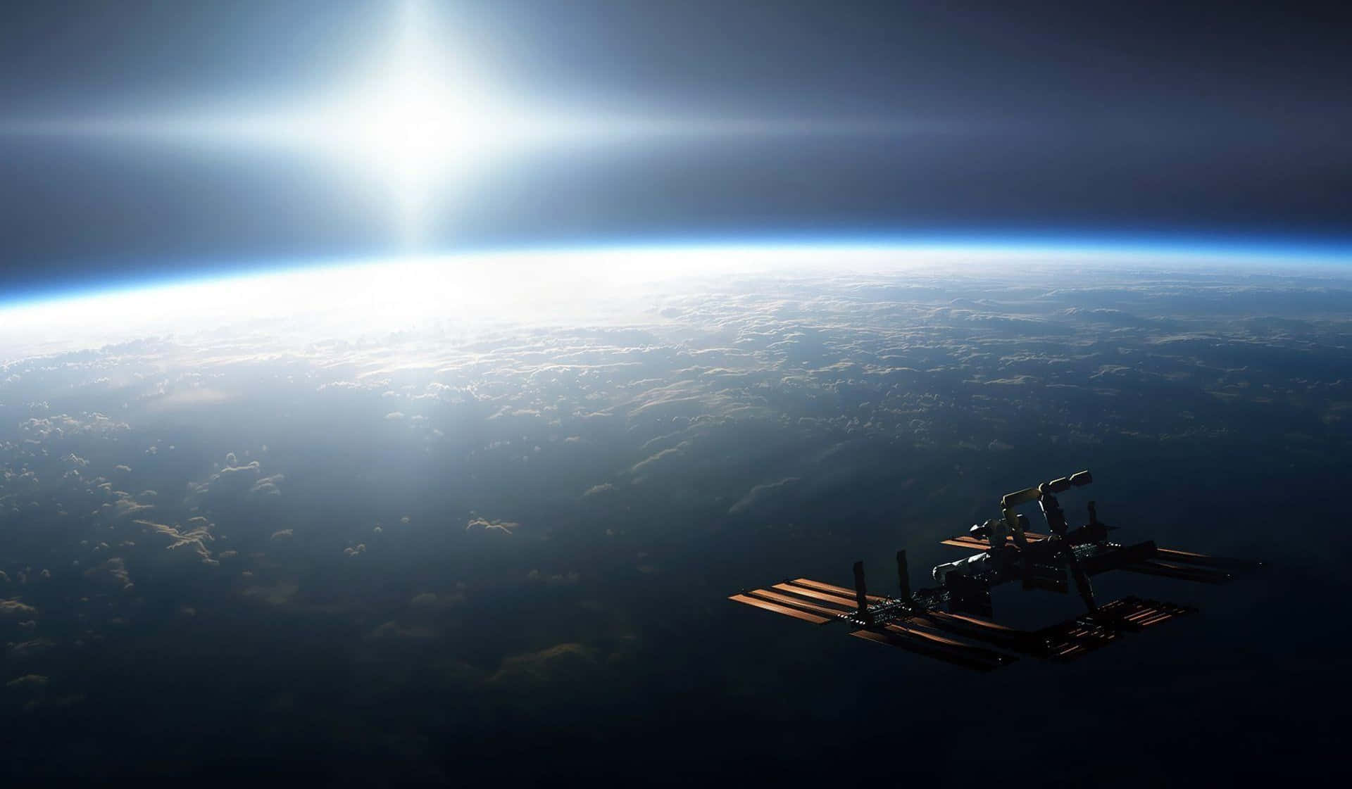 Iss 桌布 壁紙 — 一個太空站繞地球運行，太陽在彎曲的地平線和下方的雲層上方照耀。