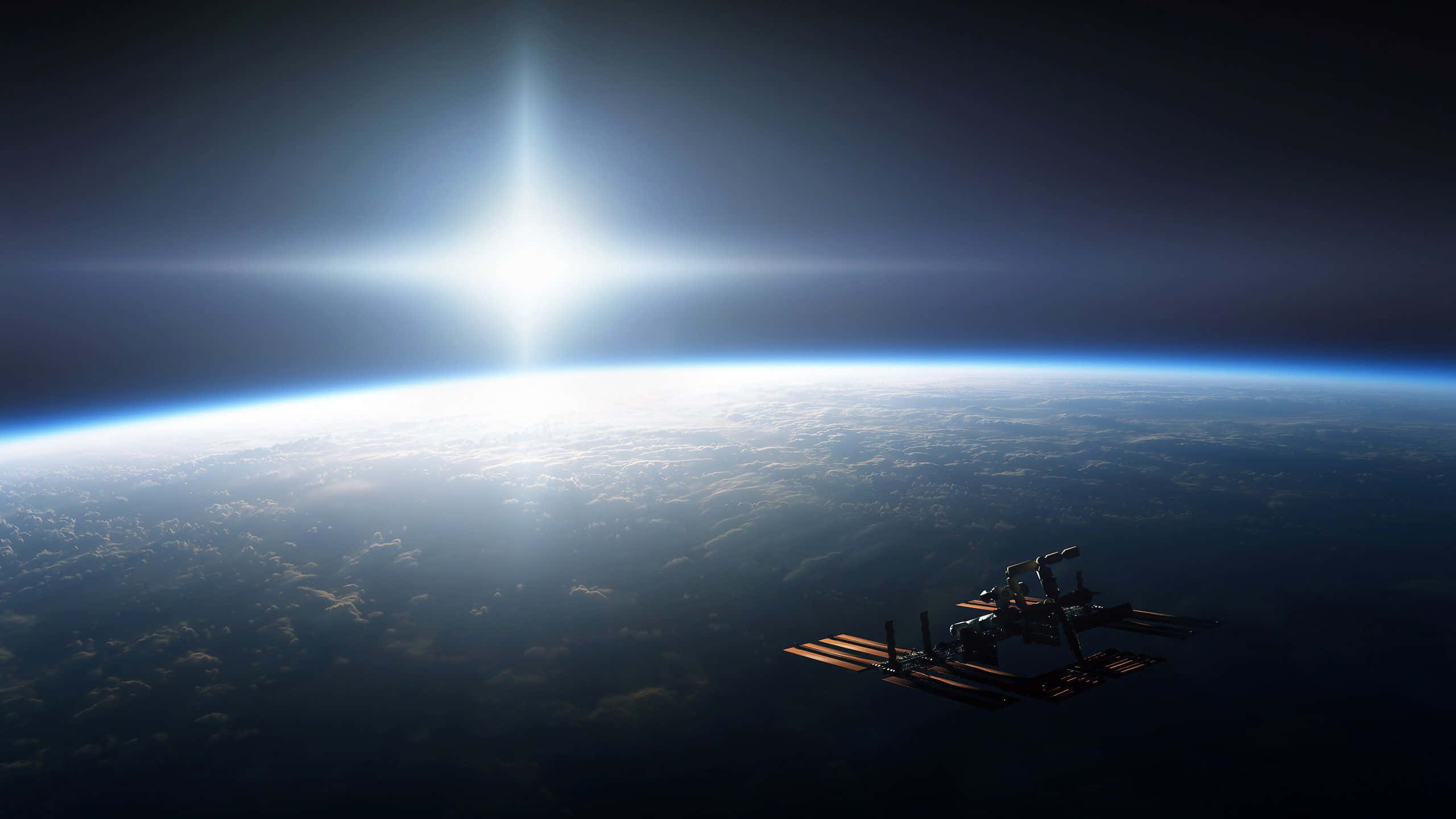 nasa 桌布 壁紙 — 一個太空站繞地球運行，太陽在行星彎曲的地平線上方明亮地照耀。