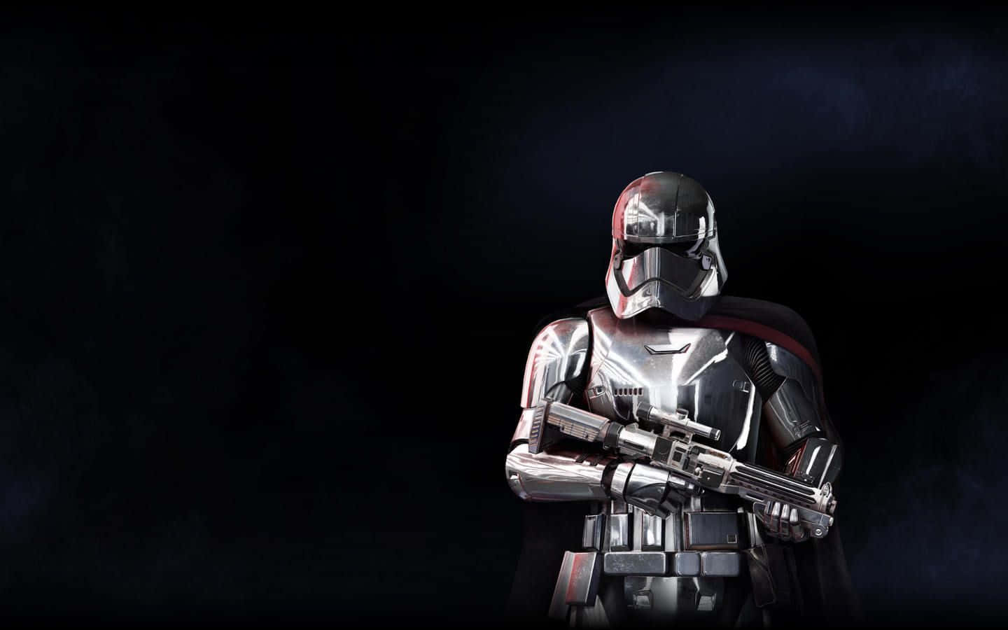 Captain Phasma 桌布 壁紙 — 一個威脅性的銀色裝甲暴風兵站在陰暗的黑暗中，手持爆能步槍。