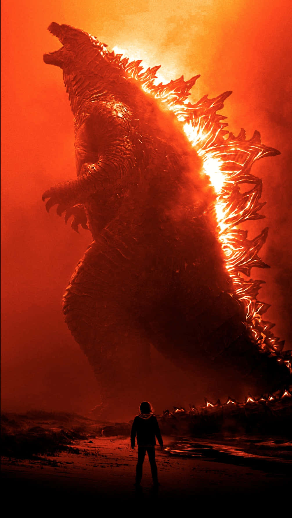 Burning Godzilla 桌布 壁紙 — 一個孤獨的人類在巨大的哥斯拉面前，敬畏地站立，哥斯拉對著火紅色的天空咆哮。