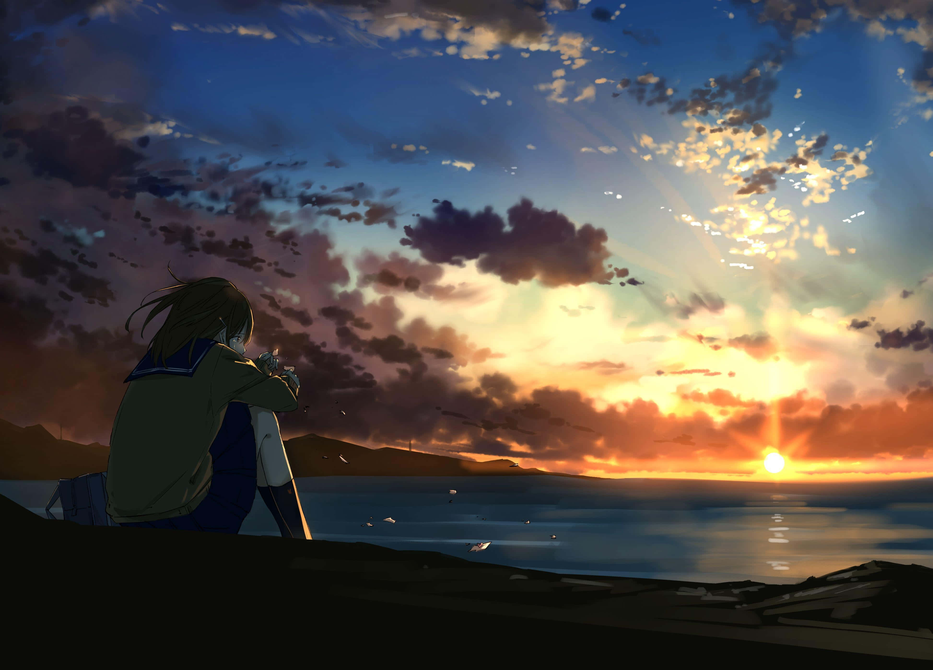 Anime Sunset 桌布 壁紙 — 一個孤獨的動漫女孩穿著校服坐在懸崖邊，看著海洋上充滿活力的日落，伴隨著戲劇性的雲彩。