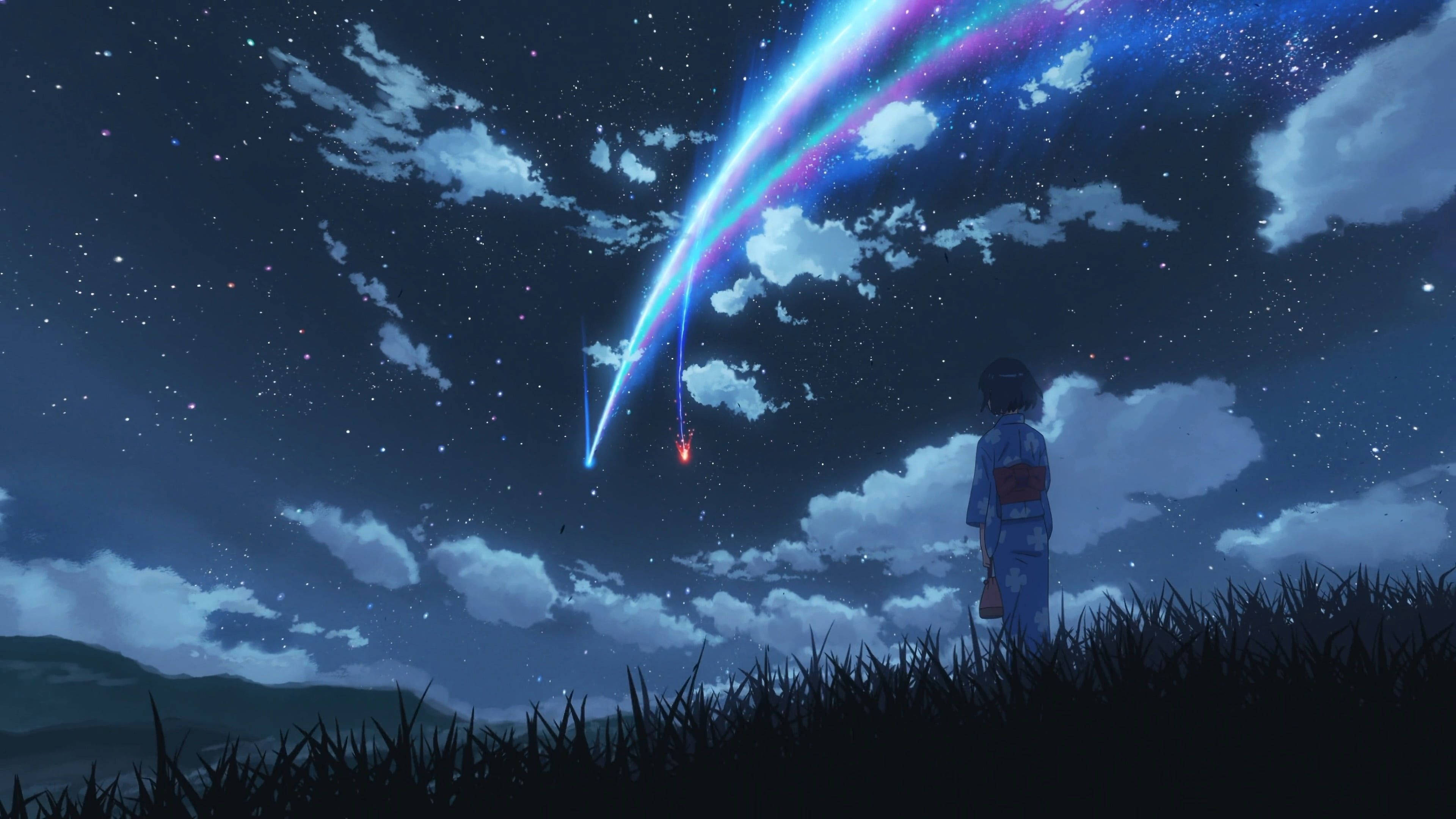 Makoto Shinkai 桌布 壁紙 — 一個孤獨的女孩穿著和服，仰望一片生動的流星雨劃過長滿草的山丘上方的星空夜空。