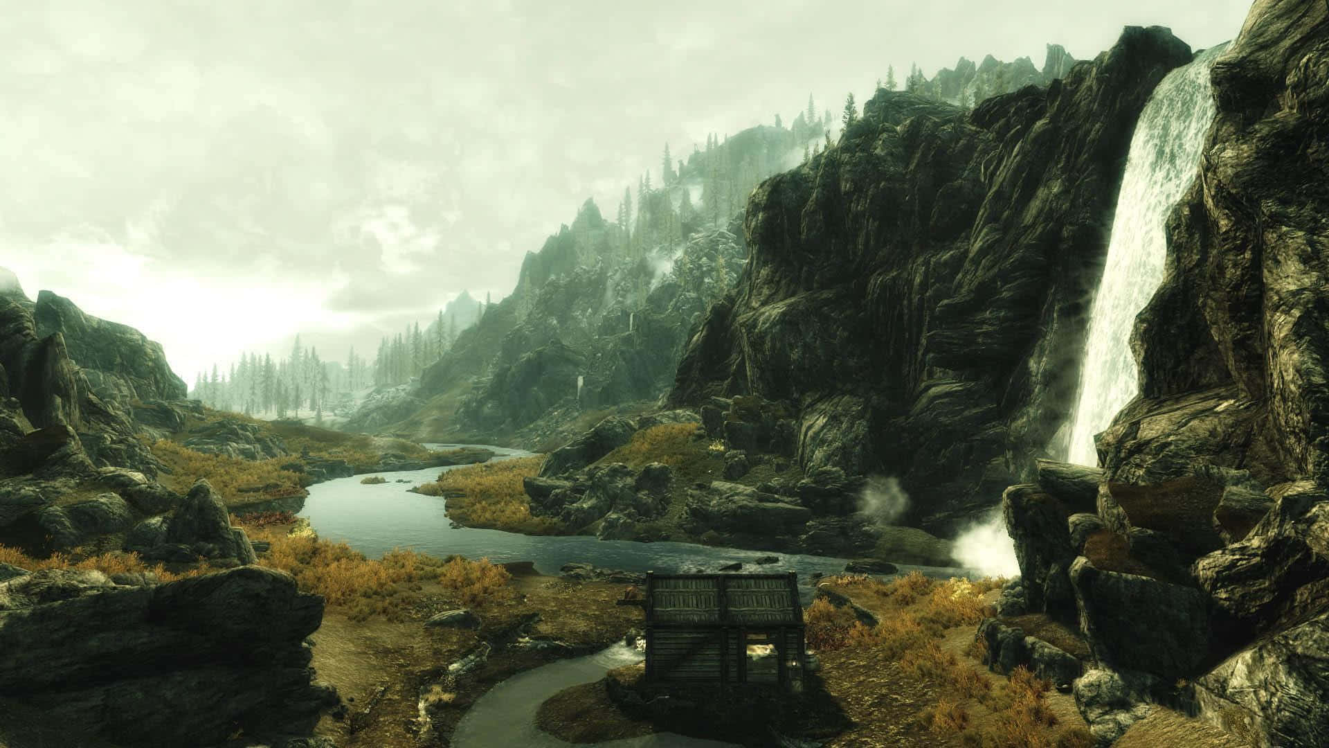 Skyrim Landscapes 桌布 壁紙 — 一個孤獨的木箱放在蜿蜒的河邊，天空迷濛，瀑布從岩石峭壁傾瀉而下。