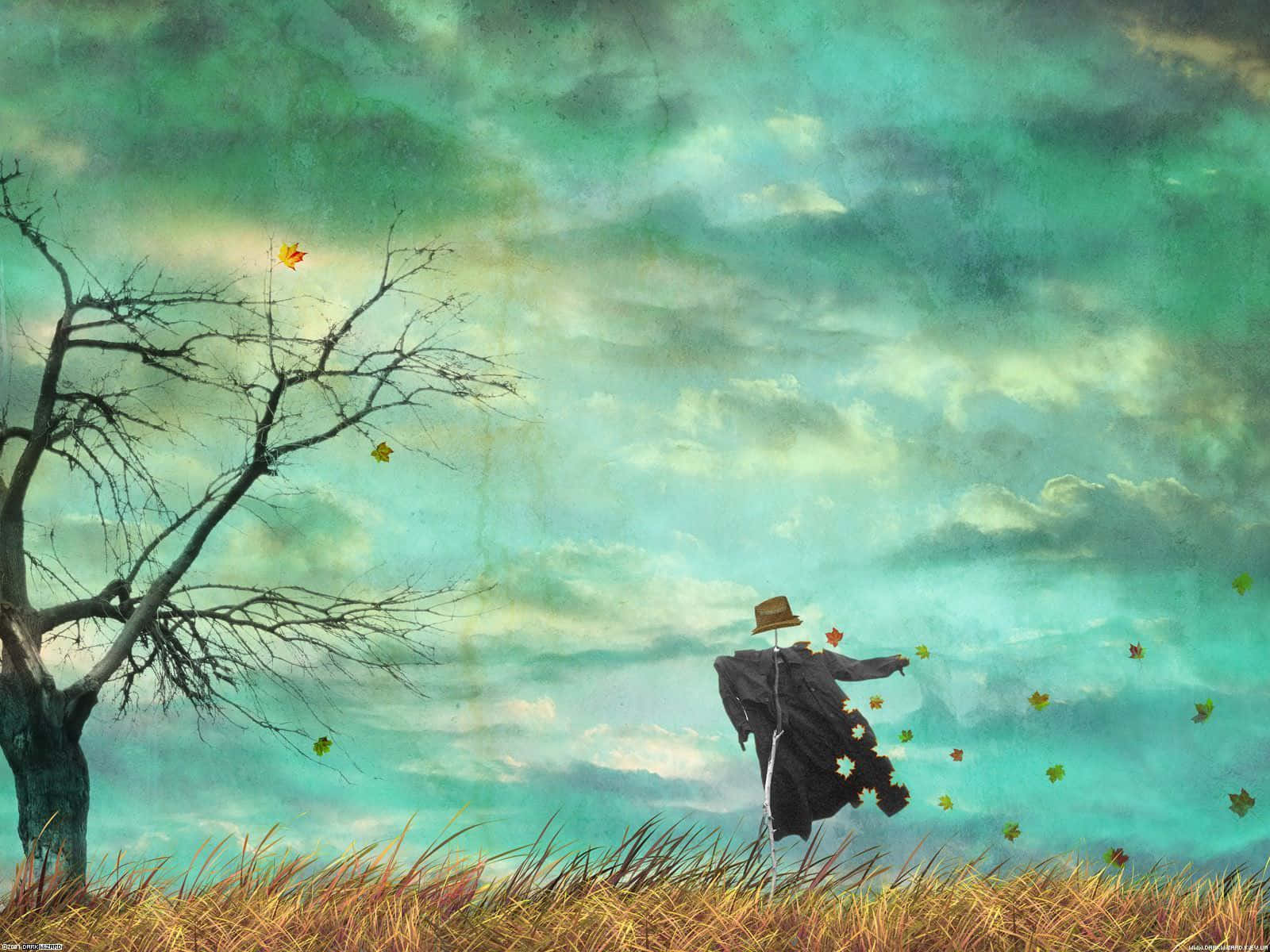 Autumn Wind 桌布 壁紙 — 一個孤獨的稻草人站在高高的草地上，背景是陰鬱的藍綠色天空，有光禿的樹木和飄落的秋葉。