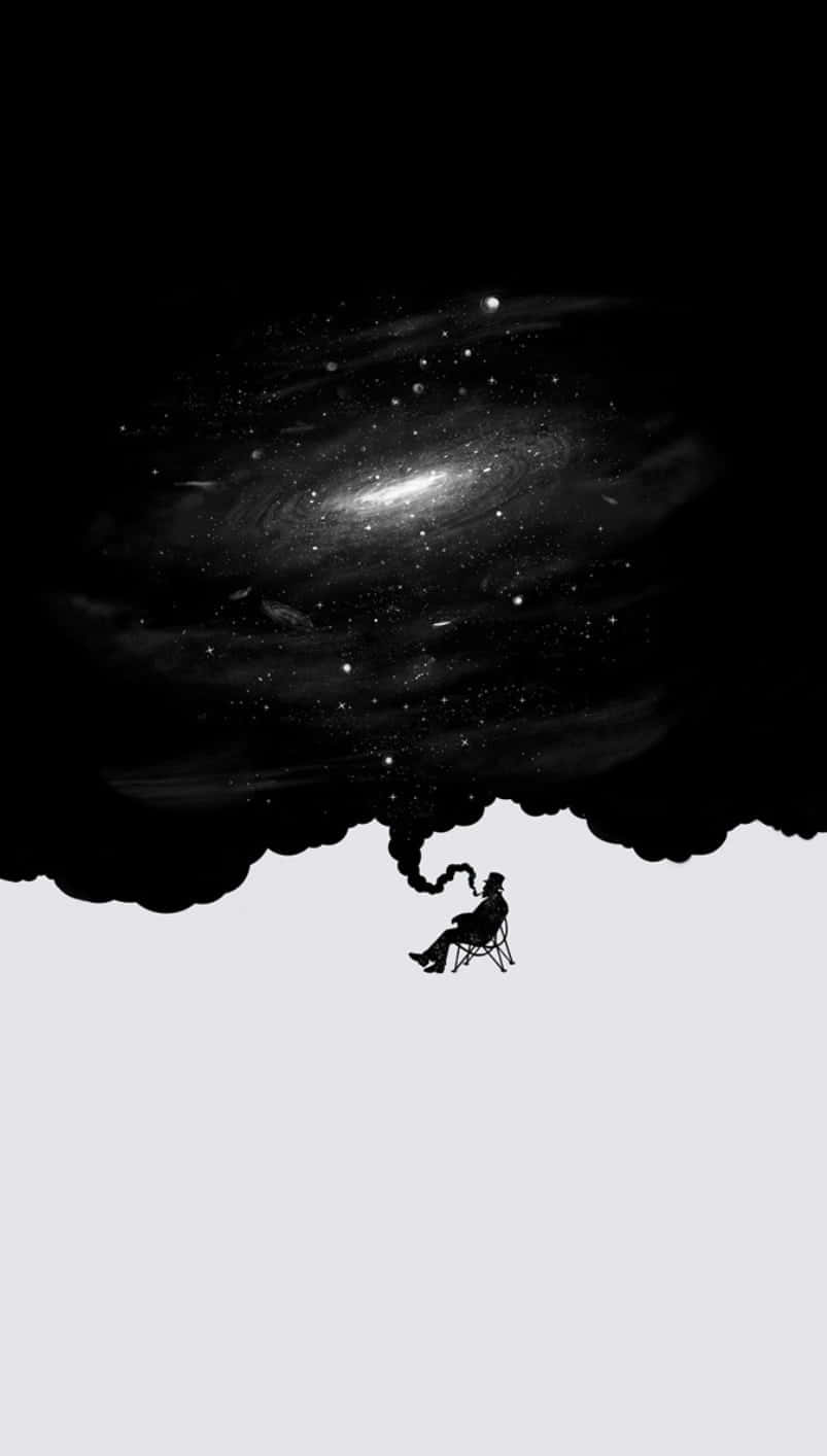 Half Black Half White 桌布 壁紙 — 一個孤獨的身影坐在椅子上面，下方是旋轉的星系，仰望上方，宇宙塵埃在周圍飄浮。