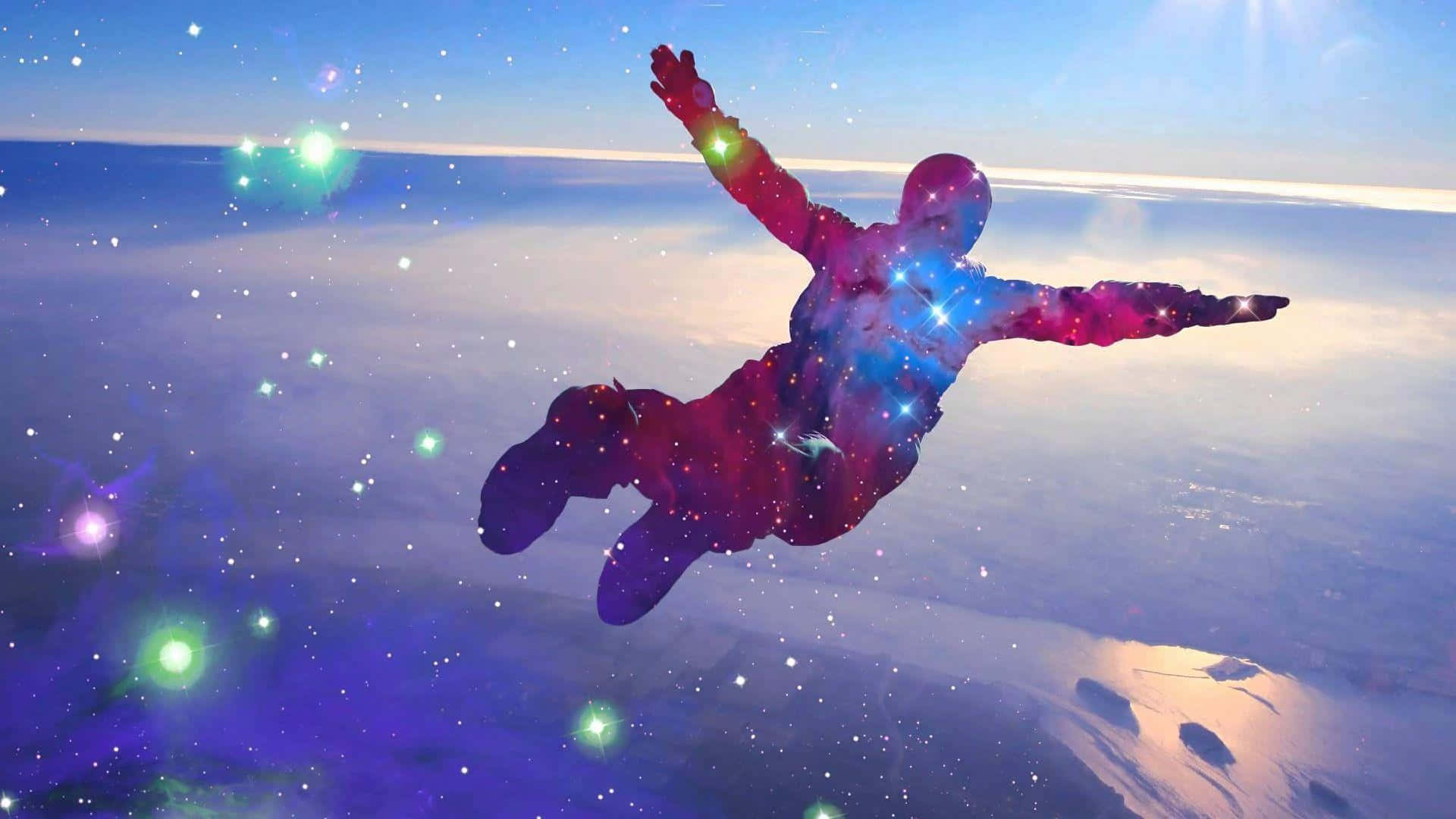 Skydiving 桌布 壁紙 — 一個宇宙人形剪影在繁星點點的星雲天空下，張開雙臂漂浮在地球之上。