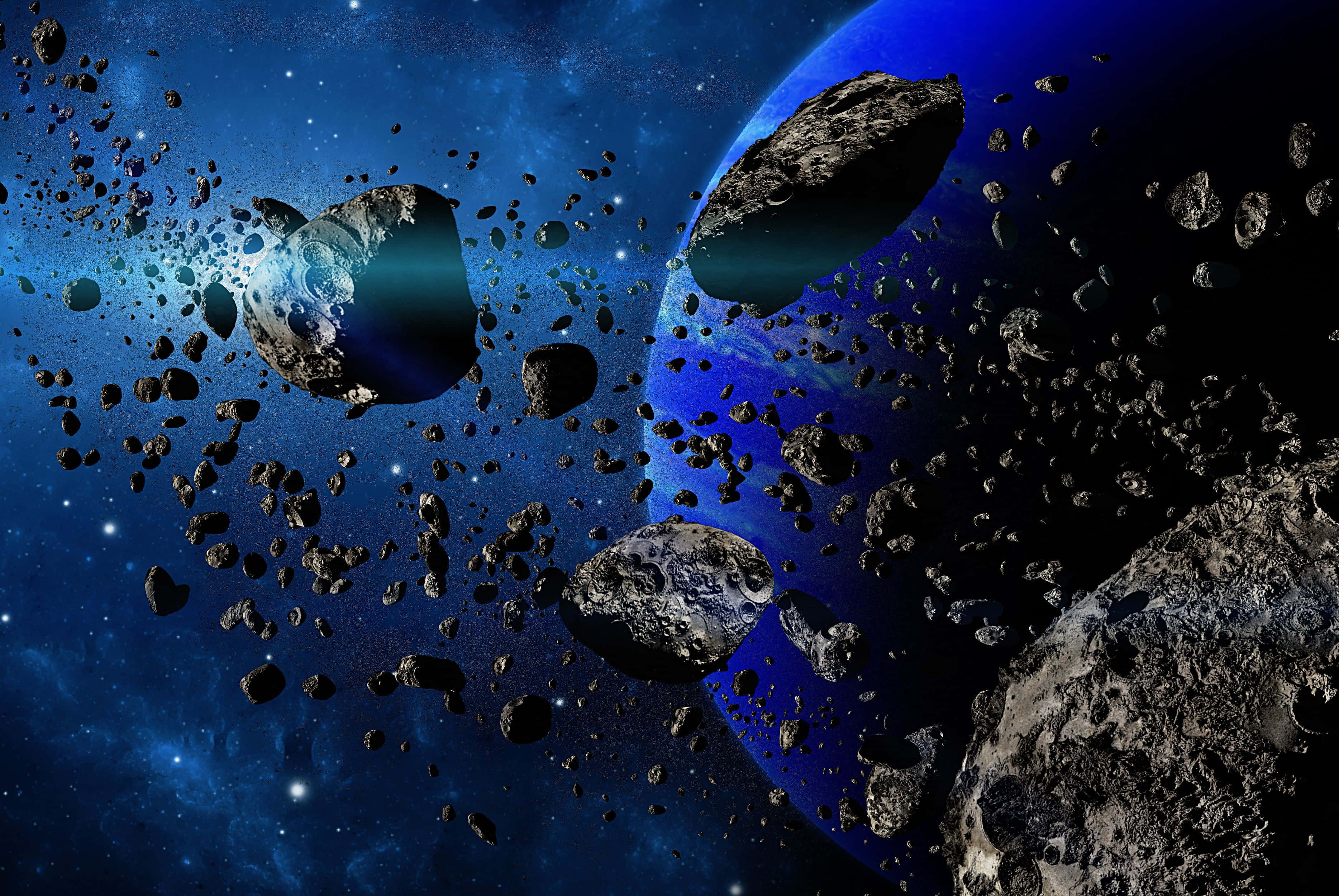 Asteroid 桌布 壁紙 — 一個宇宙場景，有一顆藍色行星和無數小行星漂浮在繁星點點的深藍色太空中。