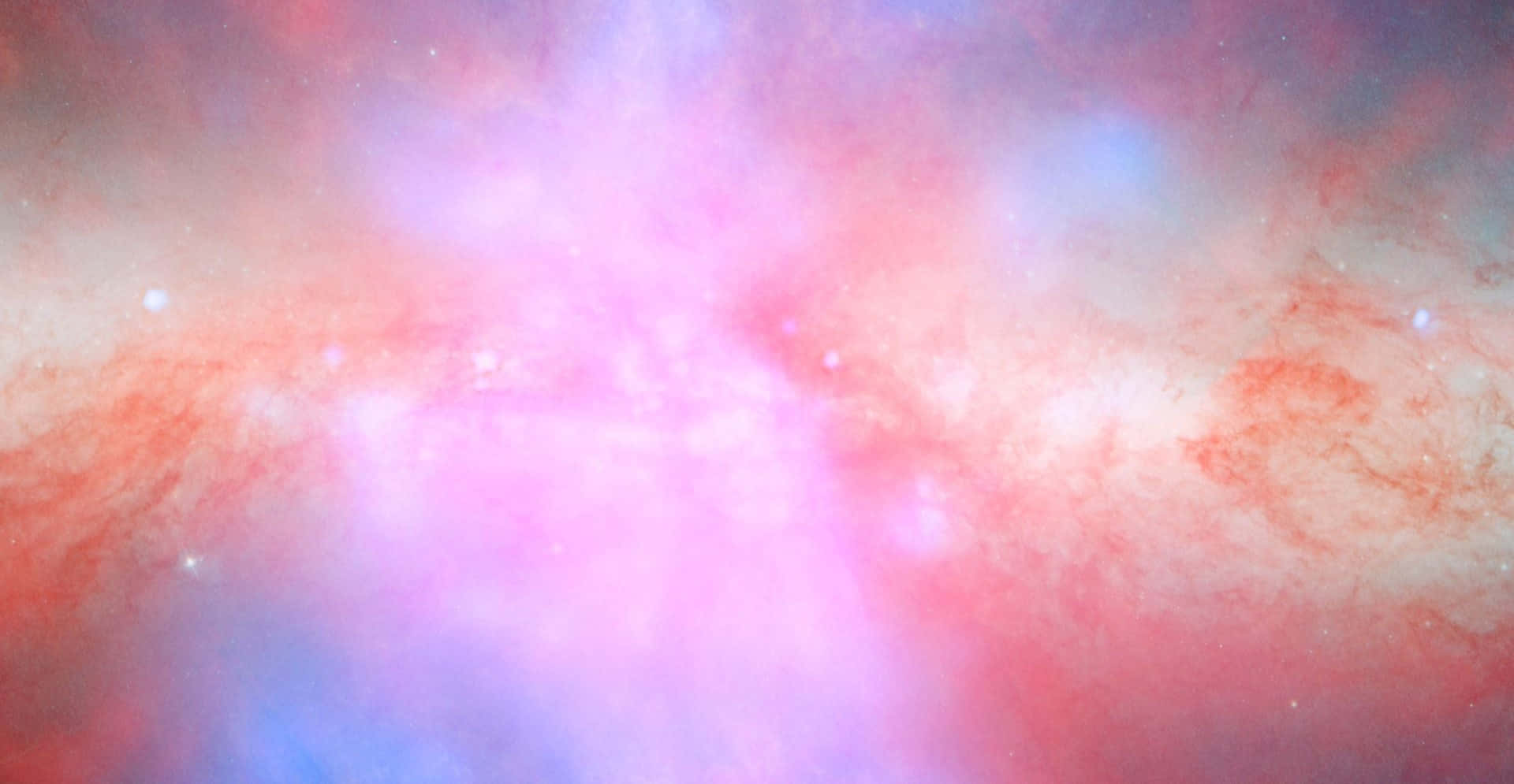Pink Galaxy 桌布 壁紙 — 一個宇宙星雲以充滿活力的粉紅色和藍色旋轉，散落的星星在宇宙背景下柔和地發光。