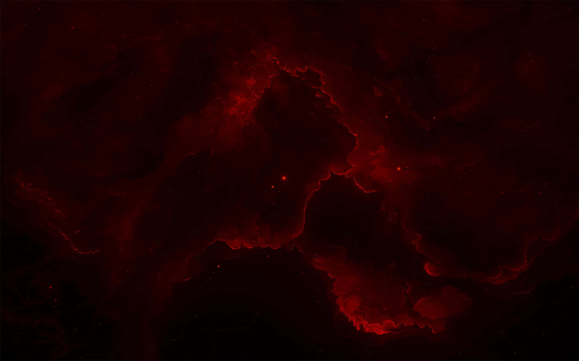 Red Space 桌布 壁紙 — 一個宇宙星雲在佈滿星星的虛空中發出深紅色的卷鬚光芒，呈現出令人難忘的美麗太空場景。