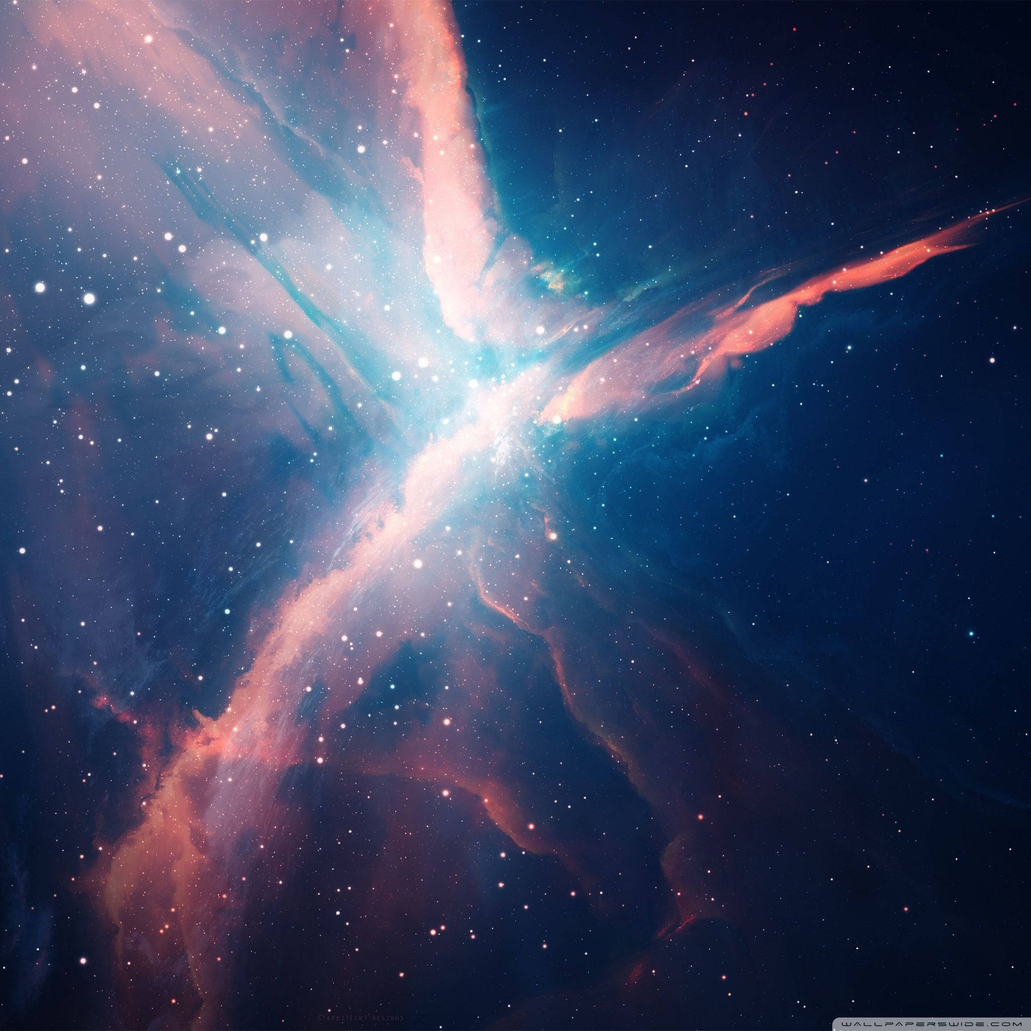 彩色 桌布 壁紙 — 一個宇宙星雲在佈滿星辰的黑暗虛空中散發出充滿活力的粉紅色和藍色色調。
