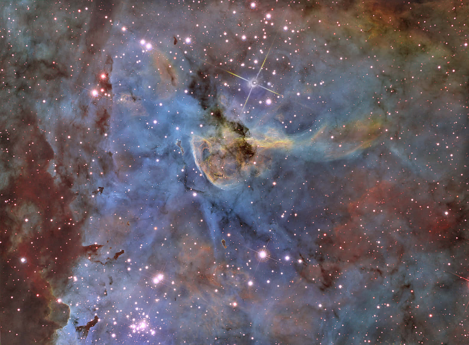 Carina Nebula 桌布 壁紙 — 一個宇宙星雲旋轉著鮮豔的藍色、紅色和黃色，無數恆星穿透其發光的宇宙雲層。