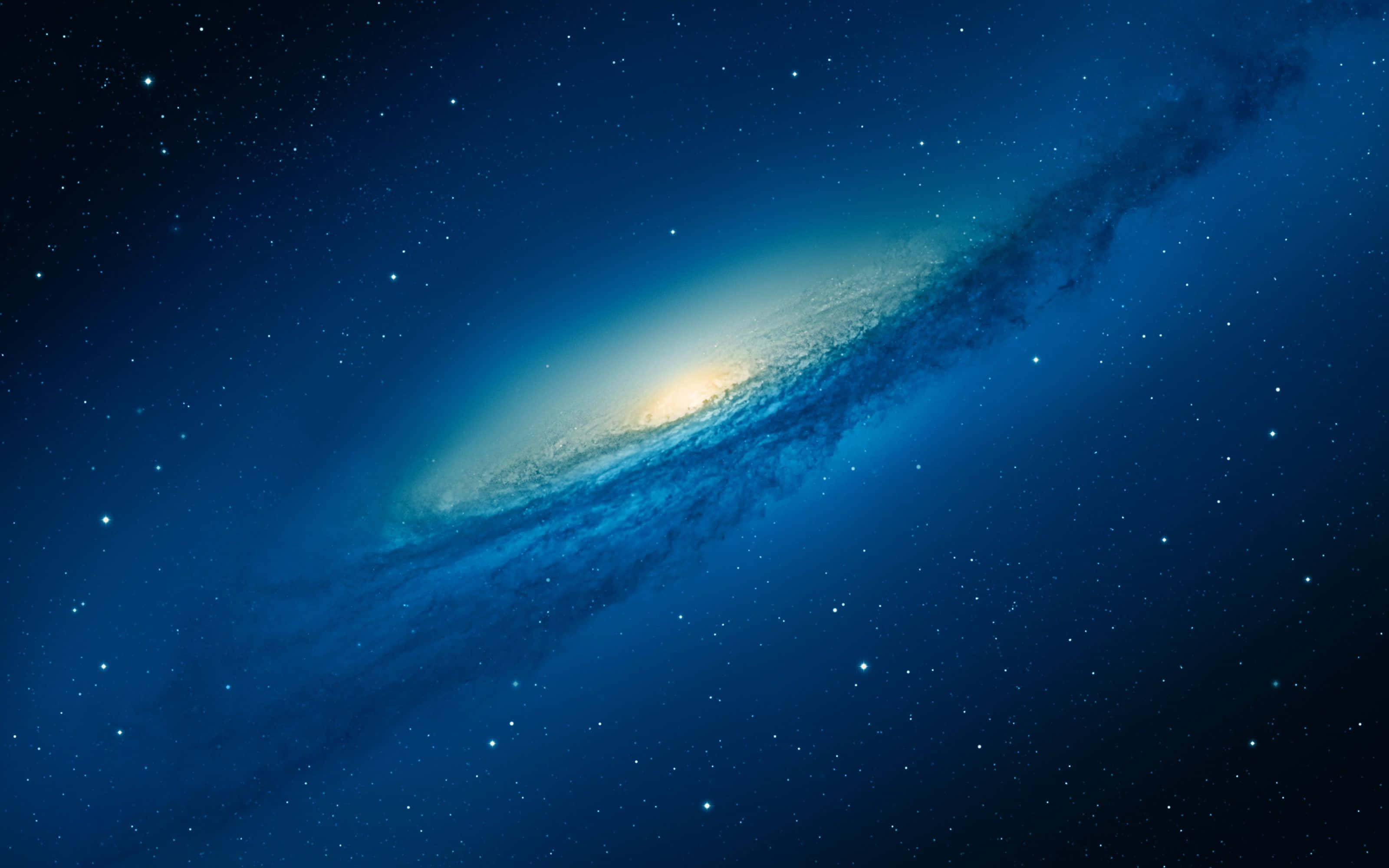 High Sierra 桌布 壁紙 — 一個宏偉的螺旋星系在星空中閃耀著明亮的黃色核心和旋轉的藍色旋臂。