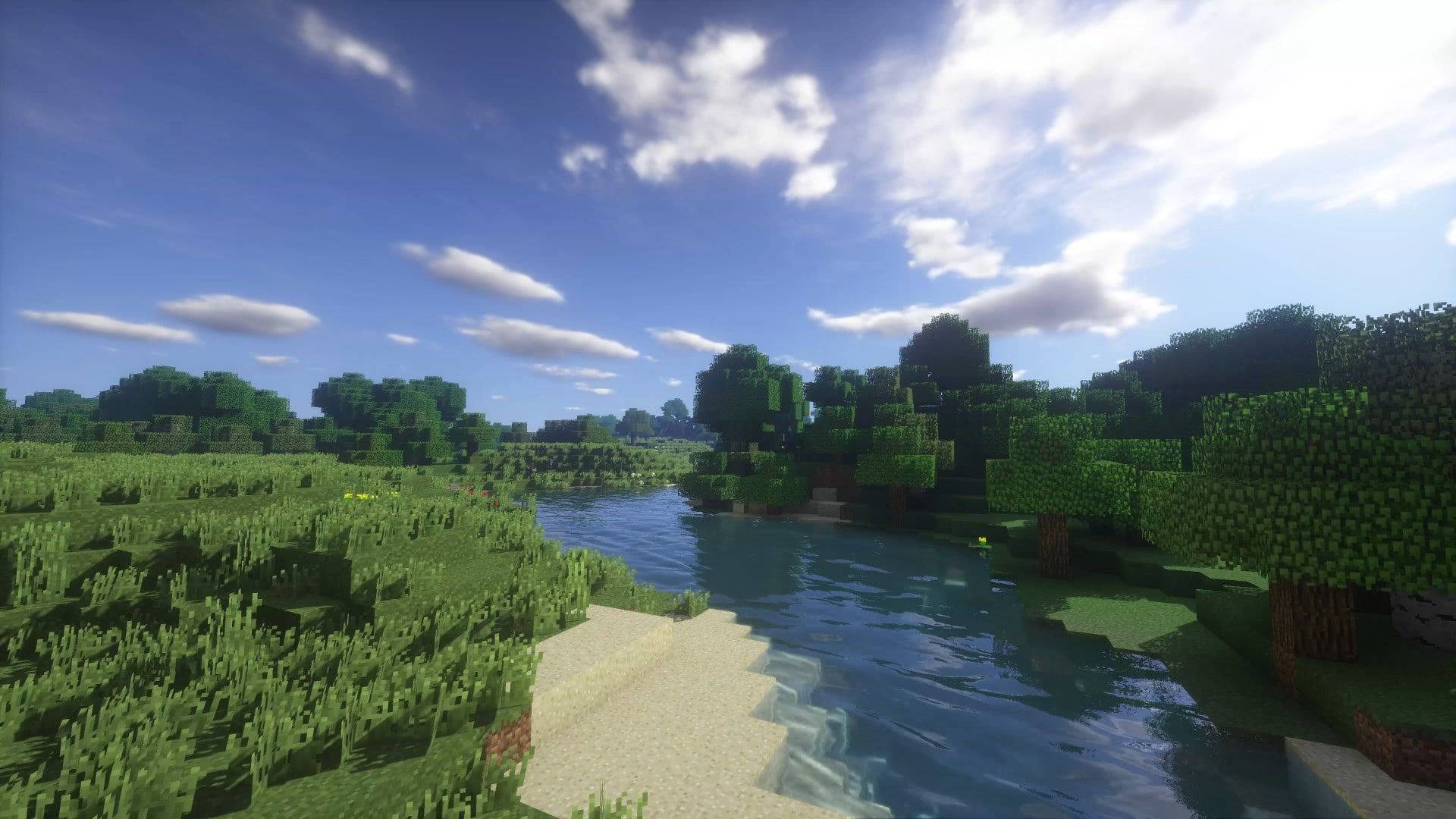 Nature Scenery 桌布 壁紙 — 一個寧靜的Minecraft景觀，蜿蜒的河流流經茂密的綠草和方塊樹木，在明亮的藍天下有蓬鬆的雲朵。