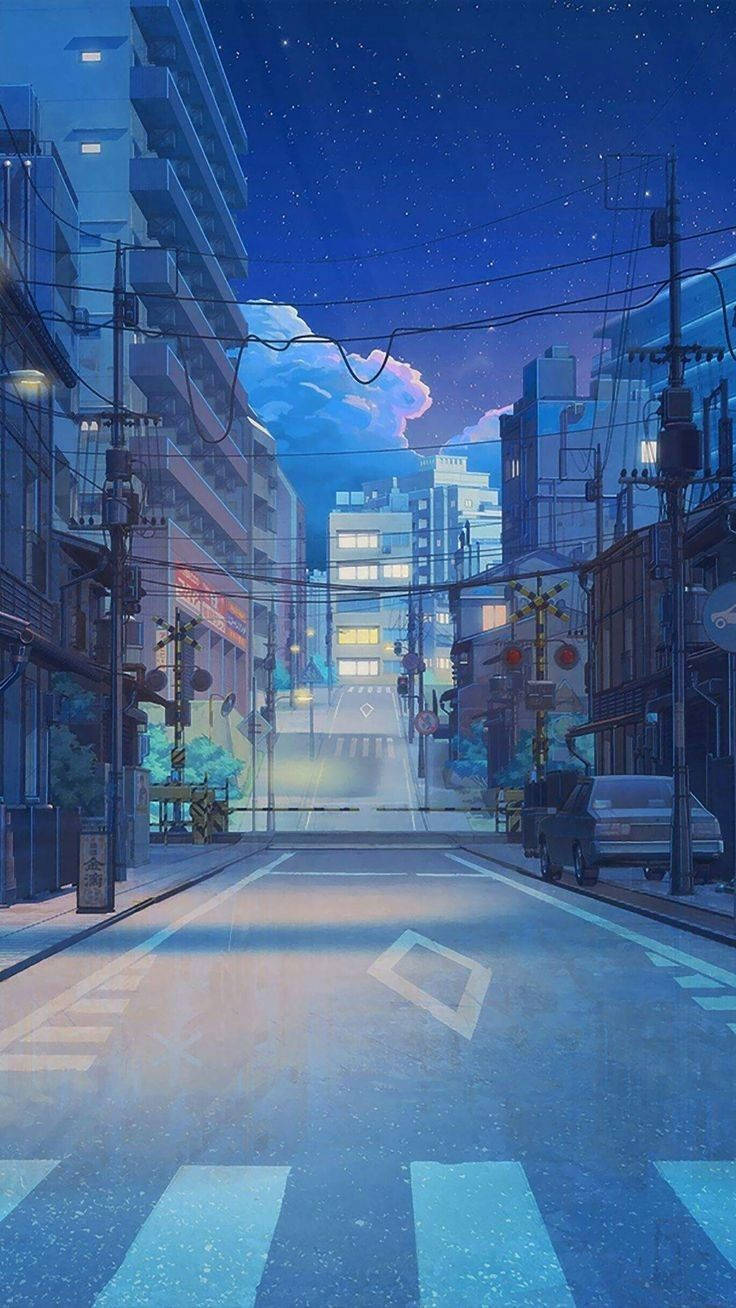Japanese Anime 桌布 壁紙 — 一個寧靜的動畫風格城市街道夜景，星空下閃爍的路燈和柔和的粉紅雲朵。