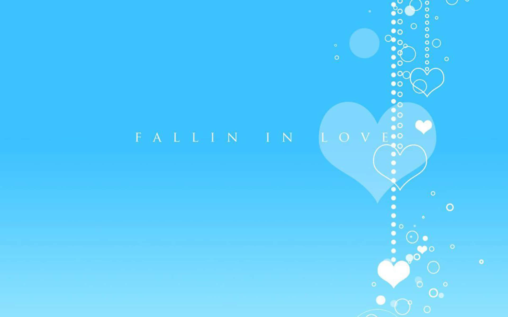 Pretty Blue 桌布 壁紙 — 一個寧靜的藍色漸變背景，白色心形和氣泡在「FALLIN IN LOVE」文字旁邊向下流動。