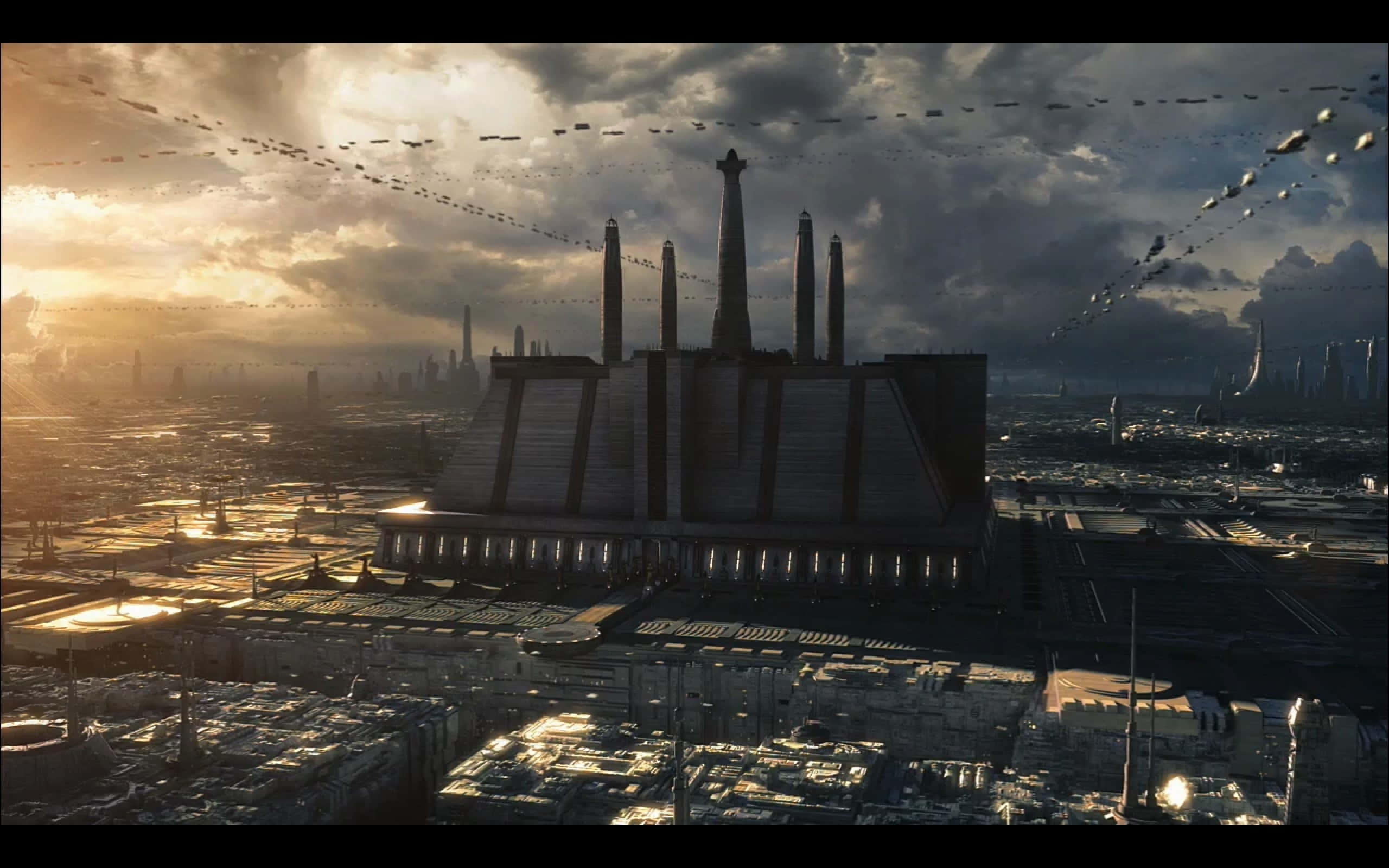 Coruscant 桌布 壁紙 — 一個巨大的工業綜合體主導著廣闊的未來城市景觀，天空佈滿飛行車輛，夕陽西下，場面壯觀。