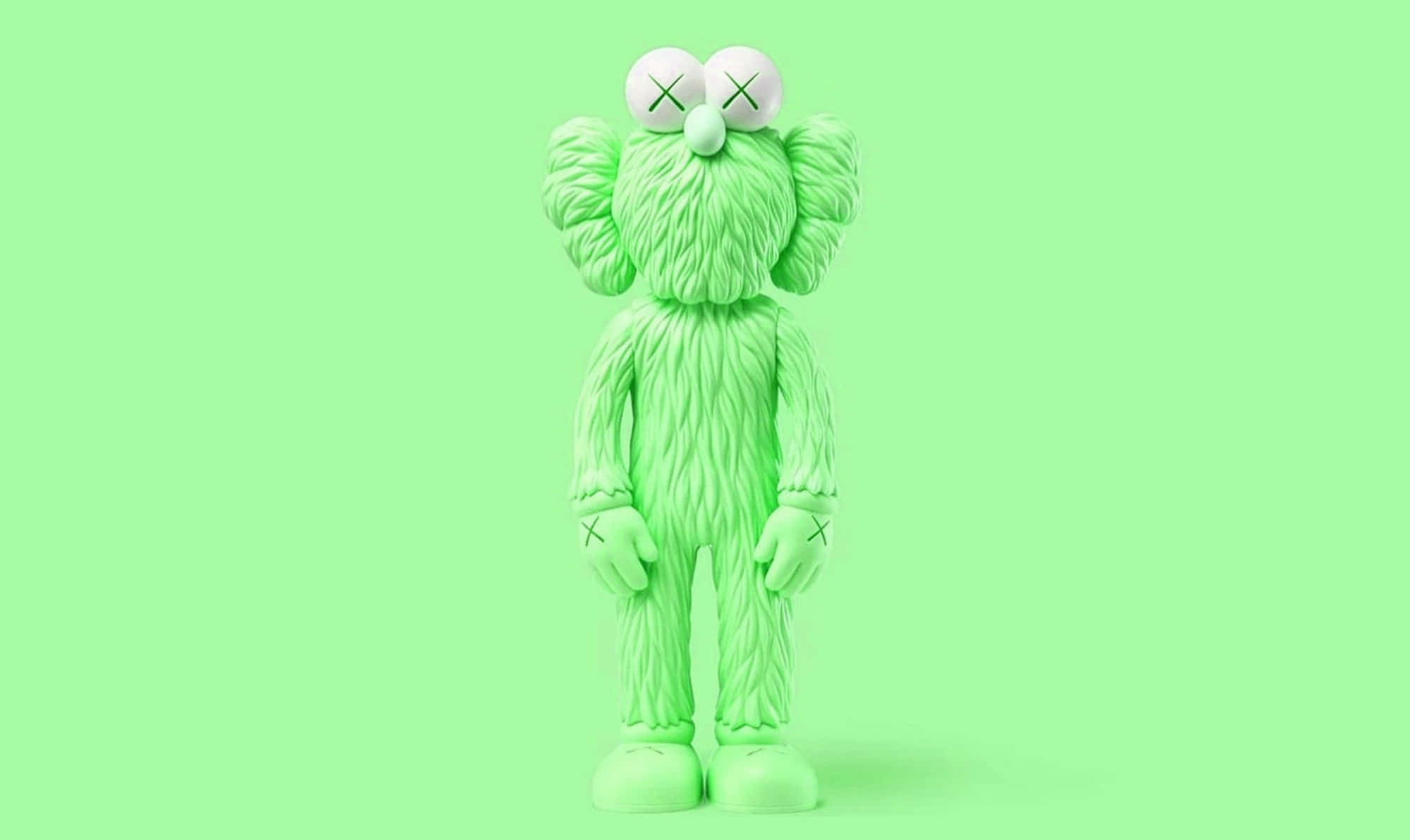 Kaws Figures 桌布 壁紙 — 一個帶有X形眼睛的石灰綠色KAWS Companion公仔，居中站立在純薄荷綠色背景上。