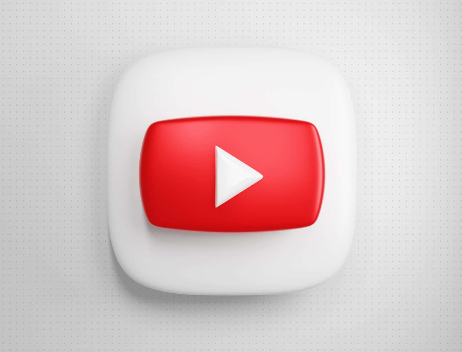 SEO 壁紙 — 一個帶有光澤的3D渲染YouTube播放按鈕圖標，居中放置在淺灰色點狀背景上。