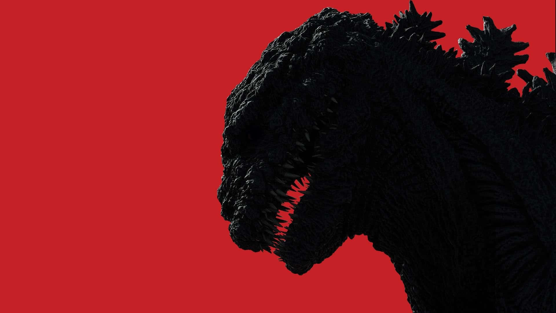 Classic Godzilla 桌布 壁紙 — 一個帶有尖刺背部和發光紅色嘴巴的黑色哥斯拉剪影，在純紅色背景上顯得威嚇。