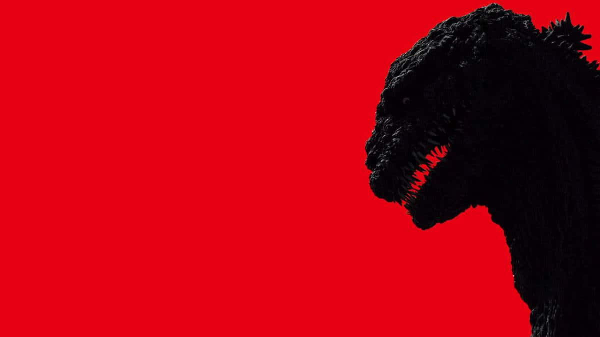 godzilla 1998 桌布 壁紙 — 一個帶有發光紅色牙齒的威脅性黑色哥斯拉剪影，背景為純紅色。