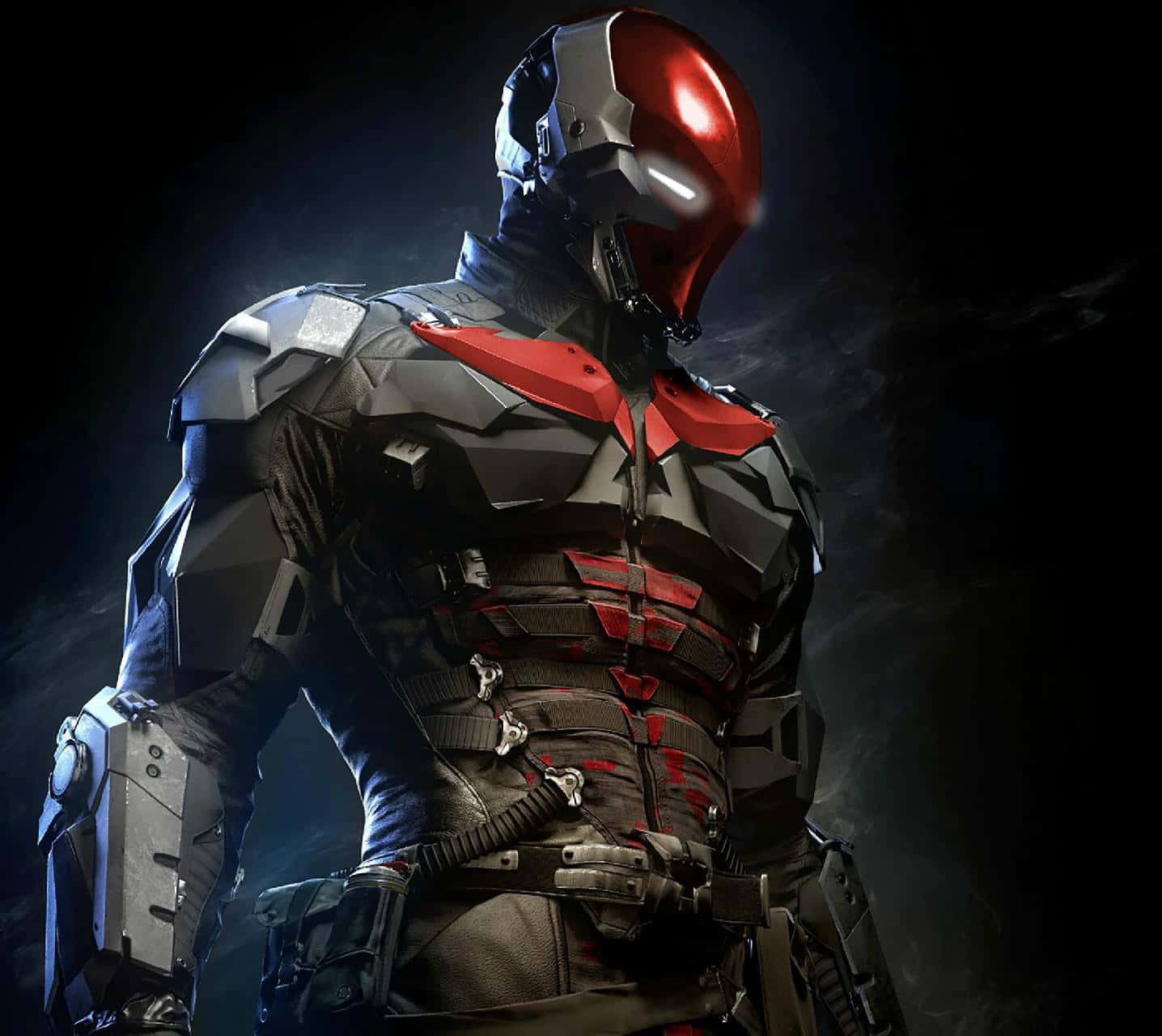 Red Hood 桌布 壁紙 — 一個帶有紅色頭盔和發光眼睛的威脅性裝甲超級英雄站在黑暗煙霧彌漫的環境中。