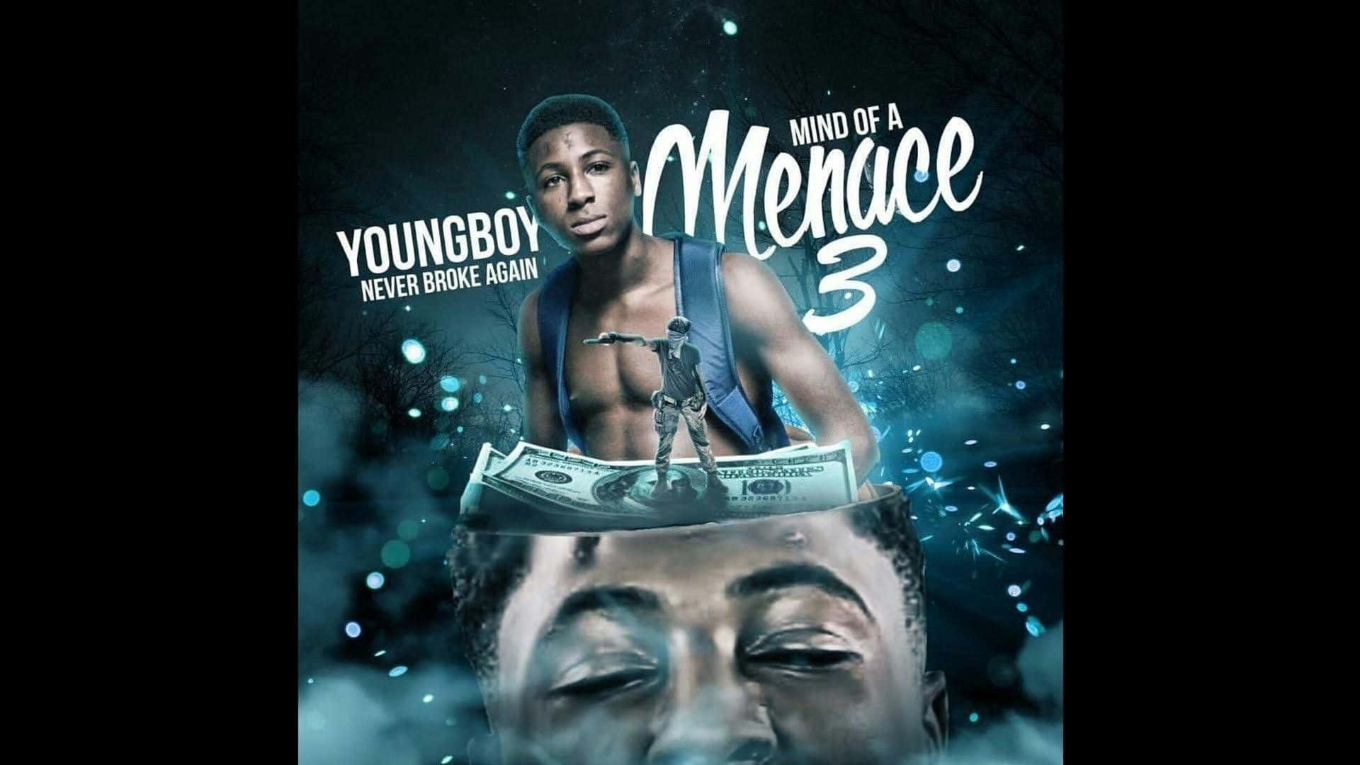 Never Broke Again Mind Of A Menace 2016 壁紙 — 一個年輕男子站在一堆一百美元鈔票上，頂部有一個微型人偶，背景是深藍色發光。