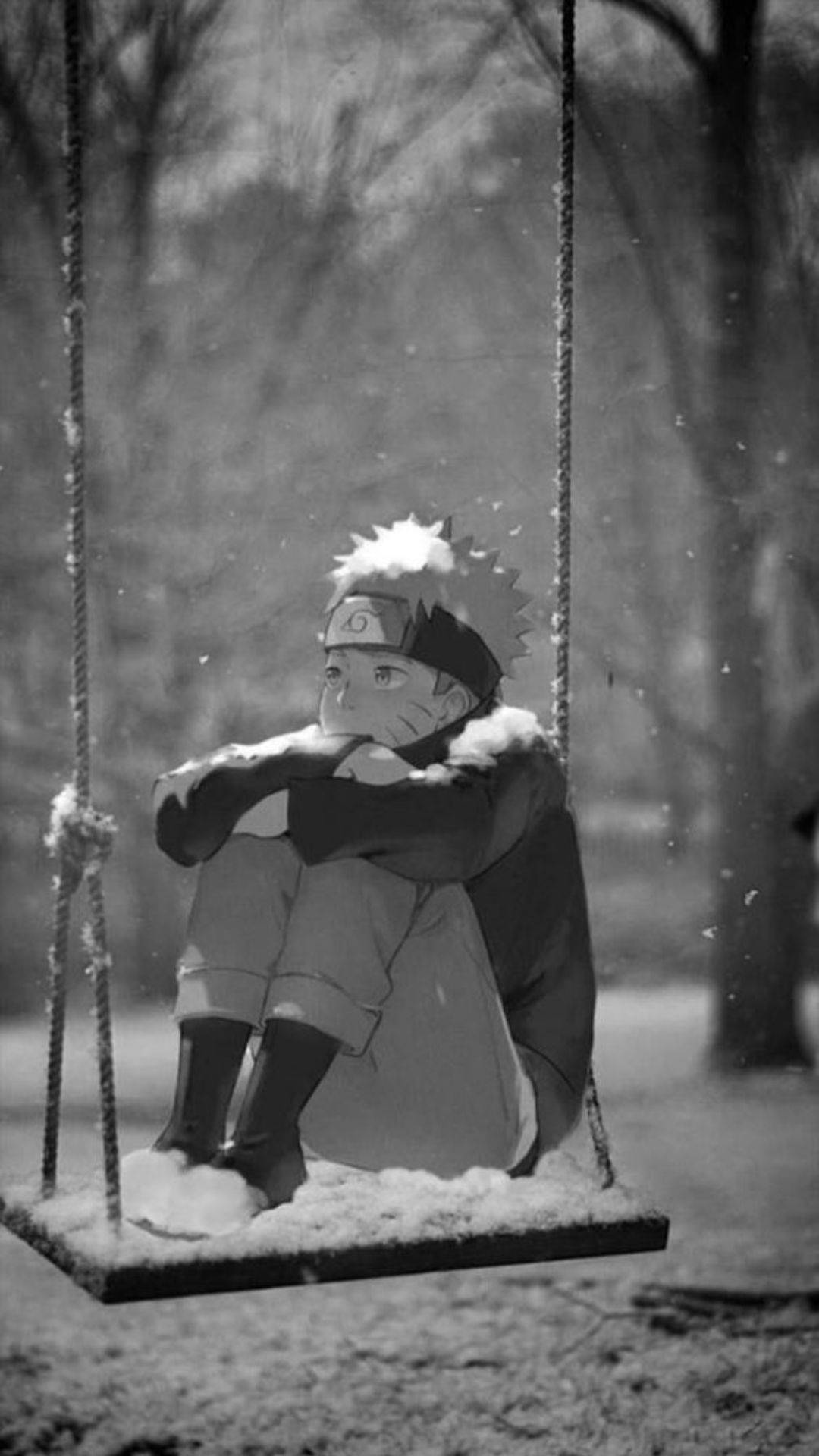 Sad Naruto 桌布 壁紙 — 一個年輕的動漫男孩獨自坐在一個被雪覆蓋的鞦韆上，在一個寧靜的冬季公園裡，雪花輕輕地飄落在他周圍。