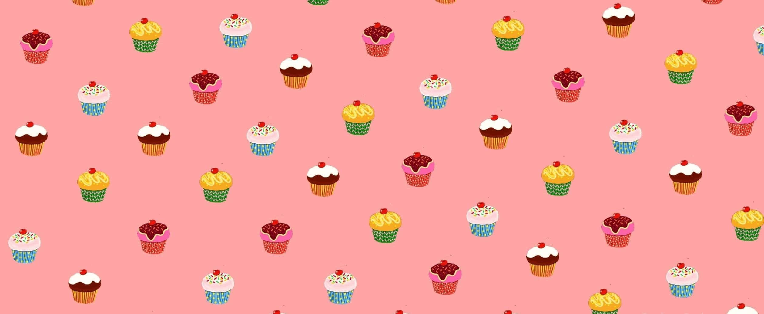 Kawaii Dessert 桌布 壁紙 — 一個快樂的圖案，色彩繽紛的杯子蛋糕配上各種糖霜和櫻桃，散落在柔和的粉紅色背景上。