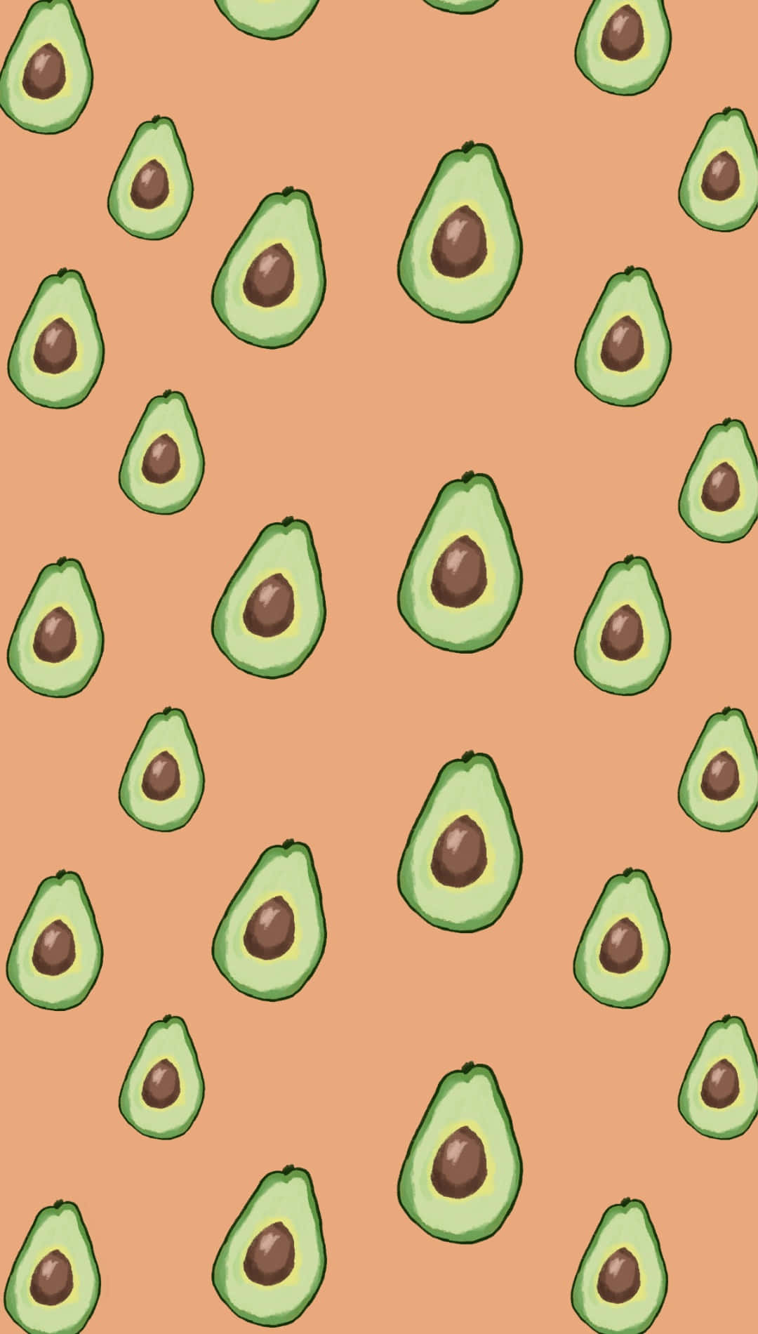 Cute Avocado 桌布 壁紙 — 一個愉快的圖案，切片牛油果帶有棕色果核散落在溫暖的桃色背景上。