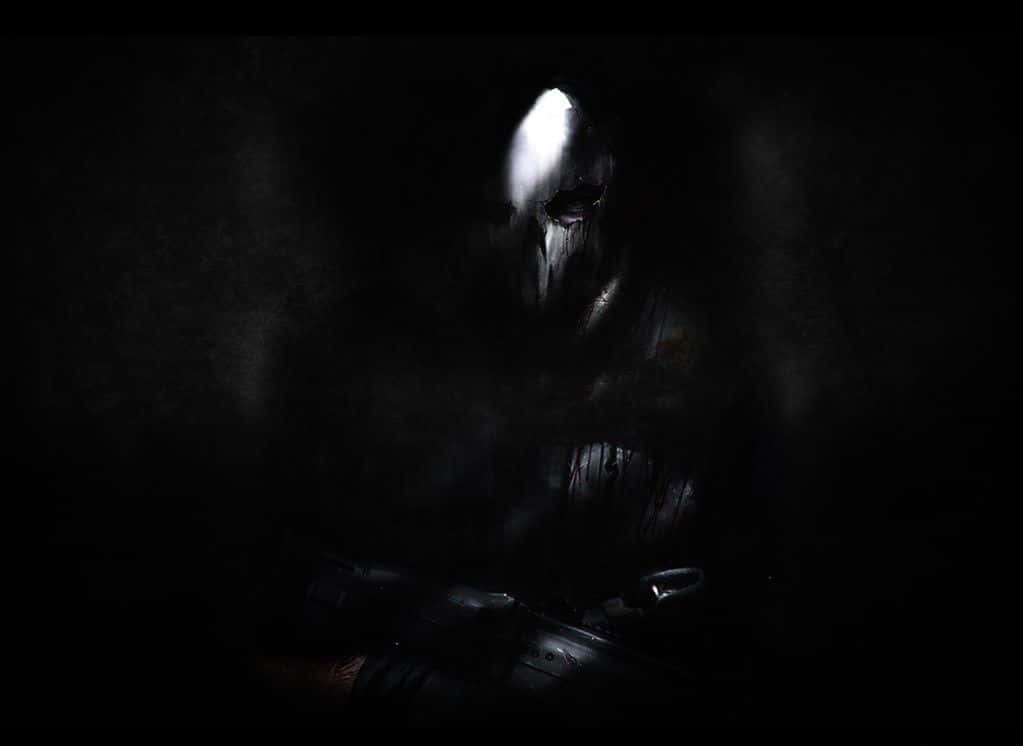 Call Of Duty Ghosts 桌布 壁紙 — 一個戴著兜帽、身穿暗影鎧甲的身影，在漆黑背景中從單一眼睛縫隙發出微弱光芒。