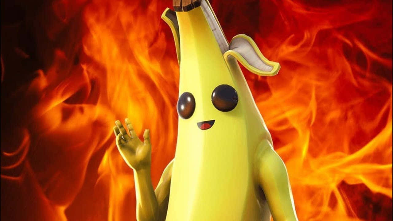 Peely Fortnite 桌布 壁紙 — 一個戴著帽子和有手臂的開心香蕉角色，在熾熱的橙色和紅色背景前揮手。