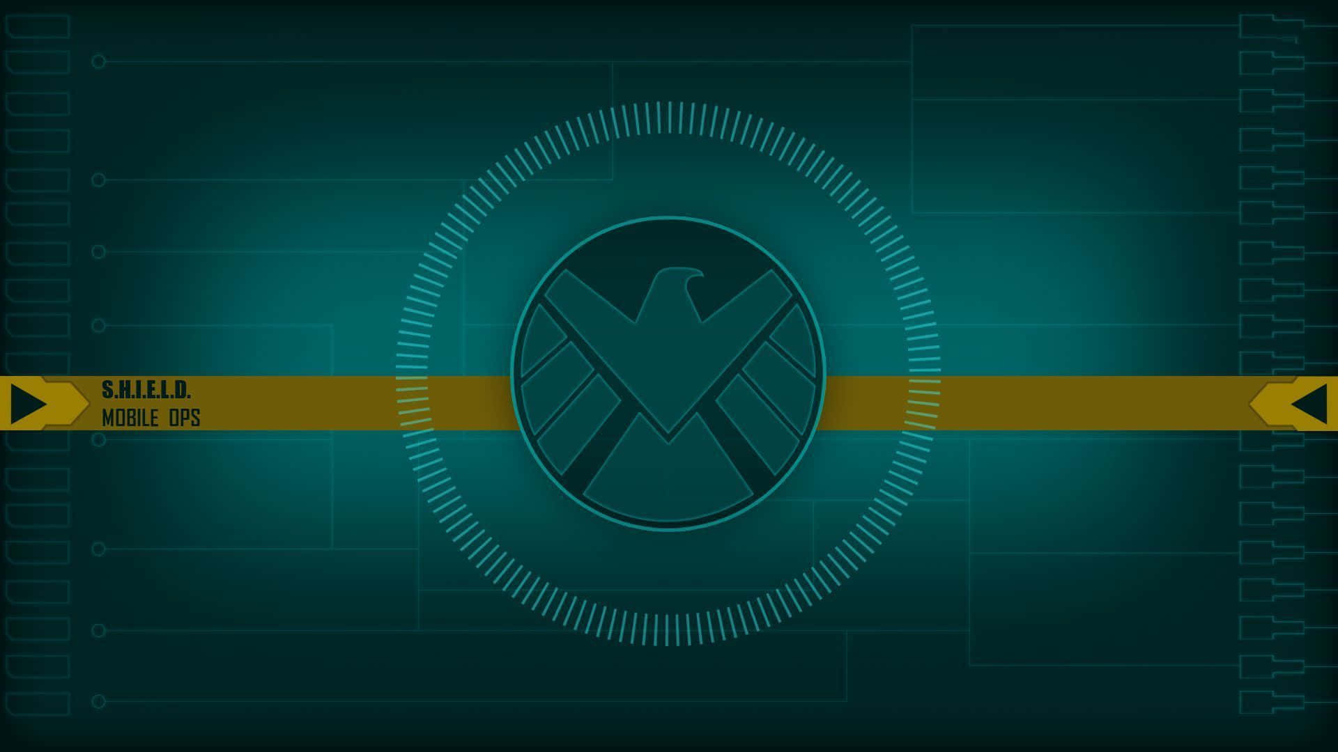 shield 桌布 壁紙 — 一個數碼介面顯示S.H.I.E.L.D.標誌，位於發光圓形HUD中央，背景為帶有電路線的青色。