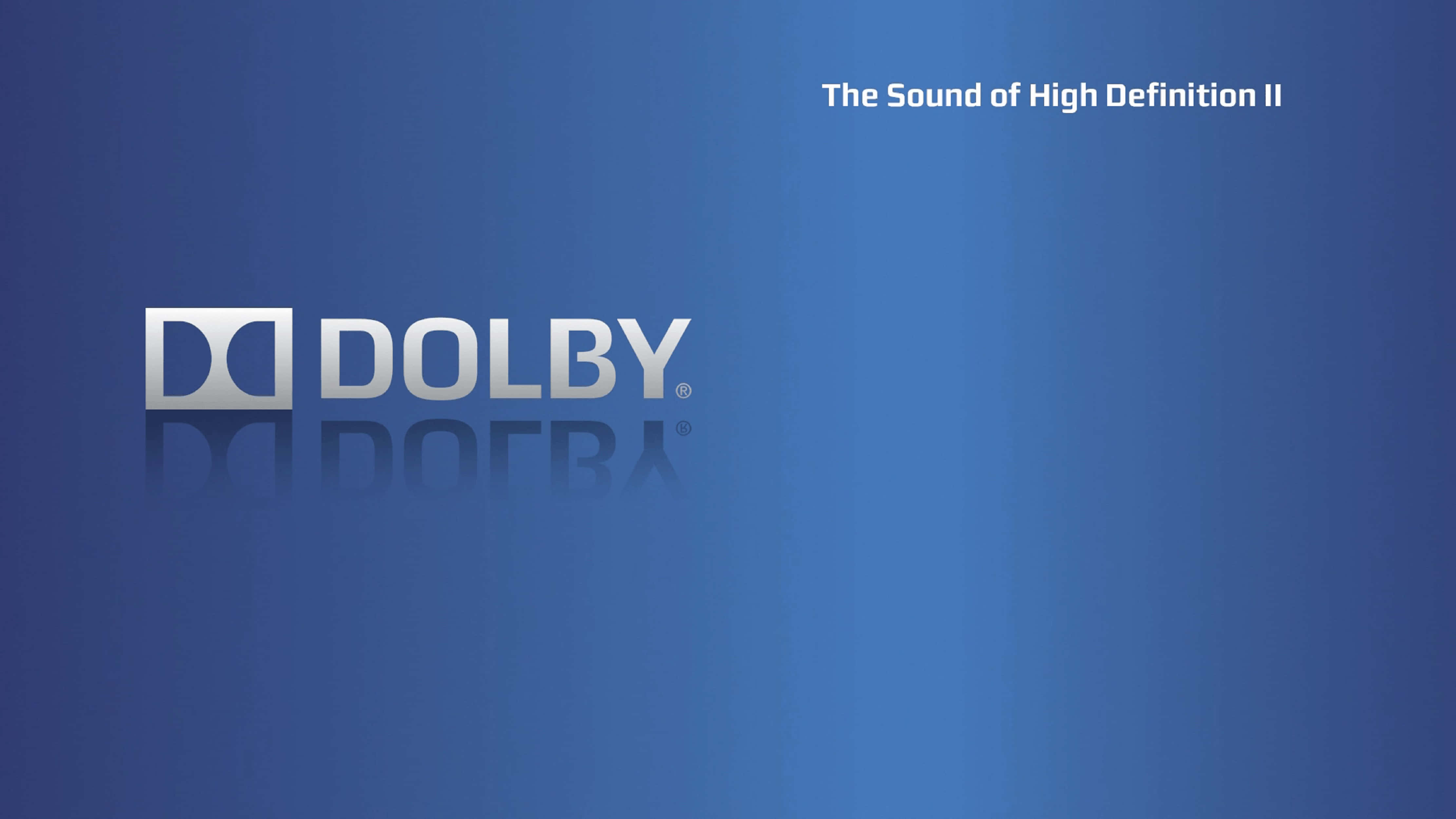 4K Dolby Vision 桌布 壁紙 — 一個時尚的Dolby標誌，帶有金屬光澤和倒影，置於漸變藍色背景上，附有標語。