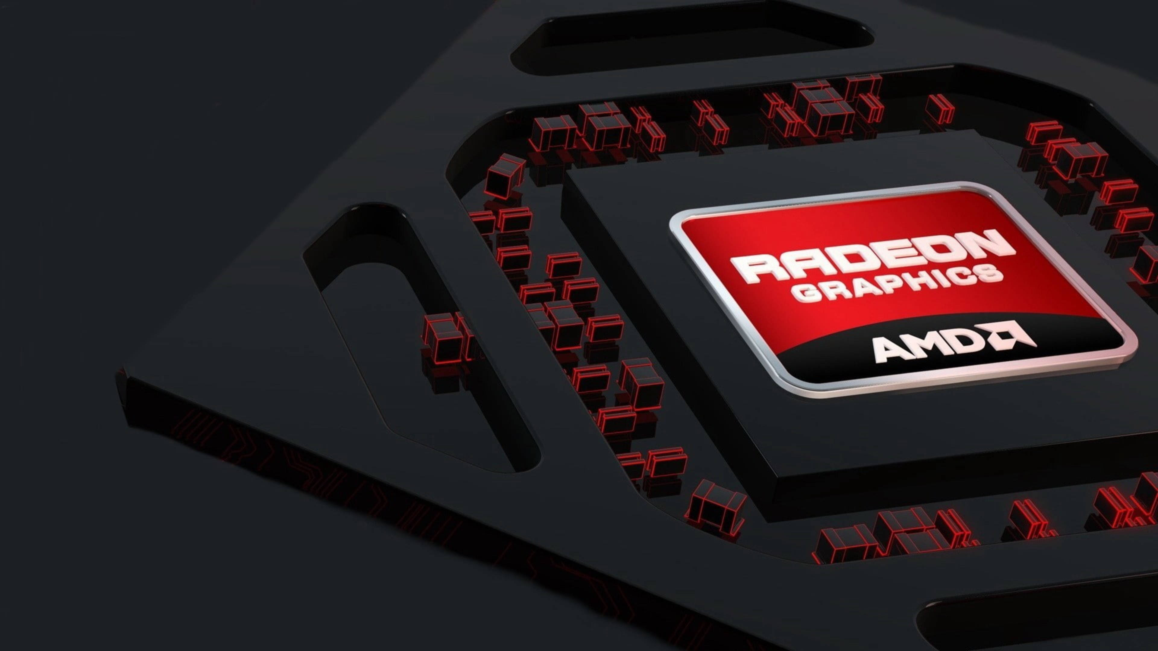 4K 桌布 壁紙 — 一個時尚的黑色AMD Radeon Graphics晶片，帶有發光的紅色電路和品牌標誌，背景為深色。
