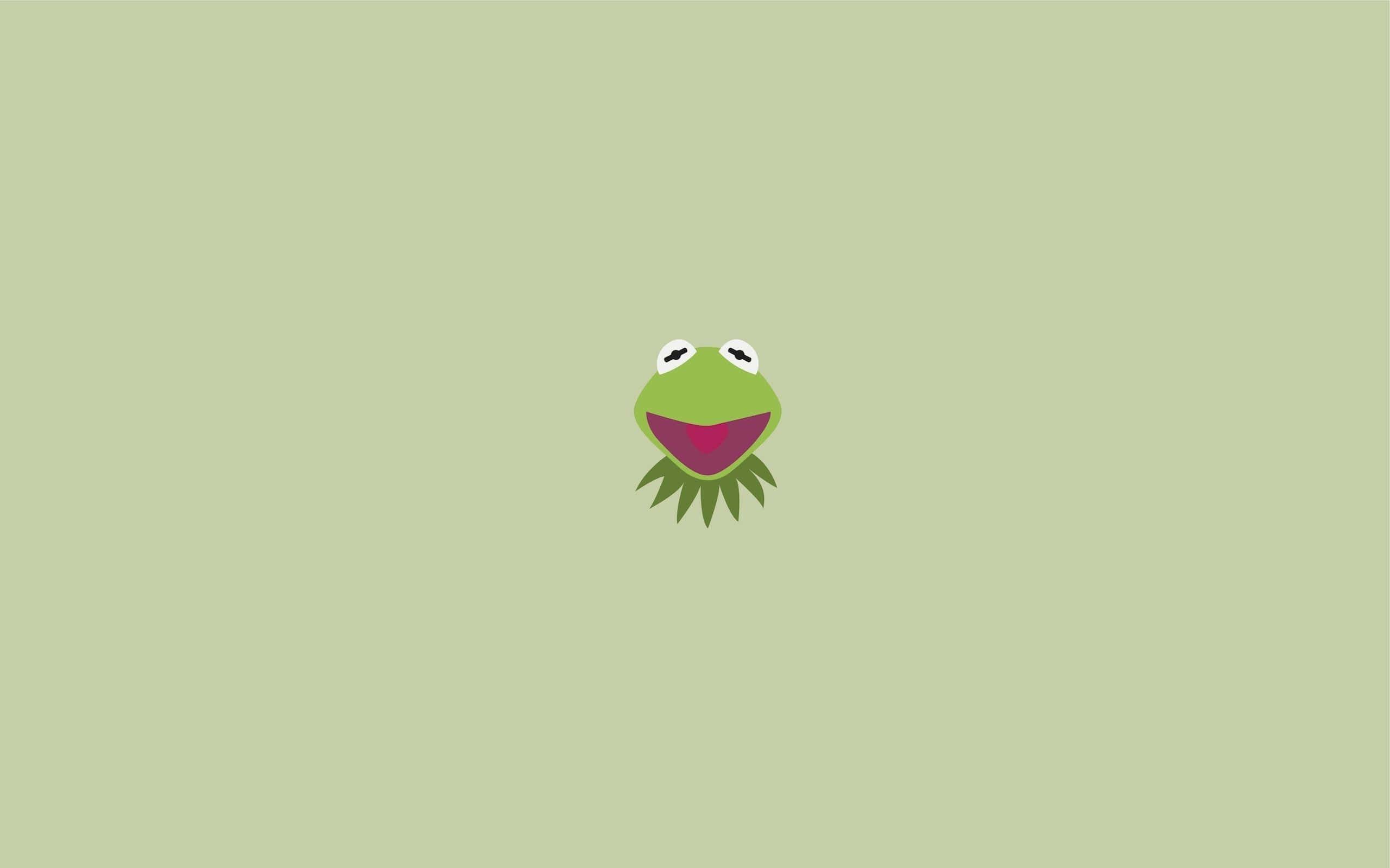 Aesthetic Frog 桌布 壁紙 — 一個極簡平面設計，將青蛙柯米特的微笑臉孔置中在純淺綠色背景上。
