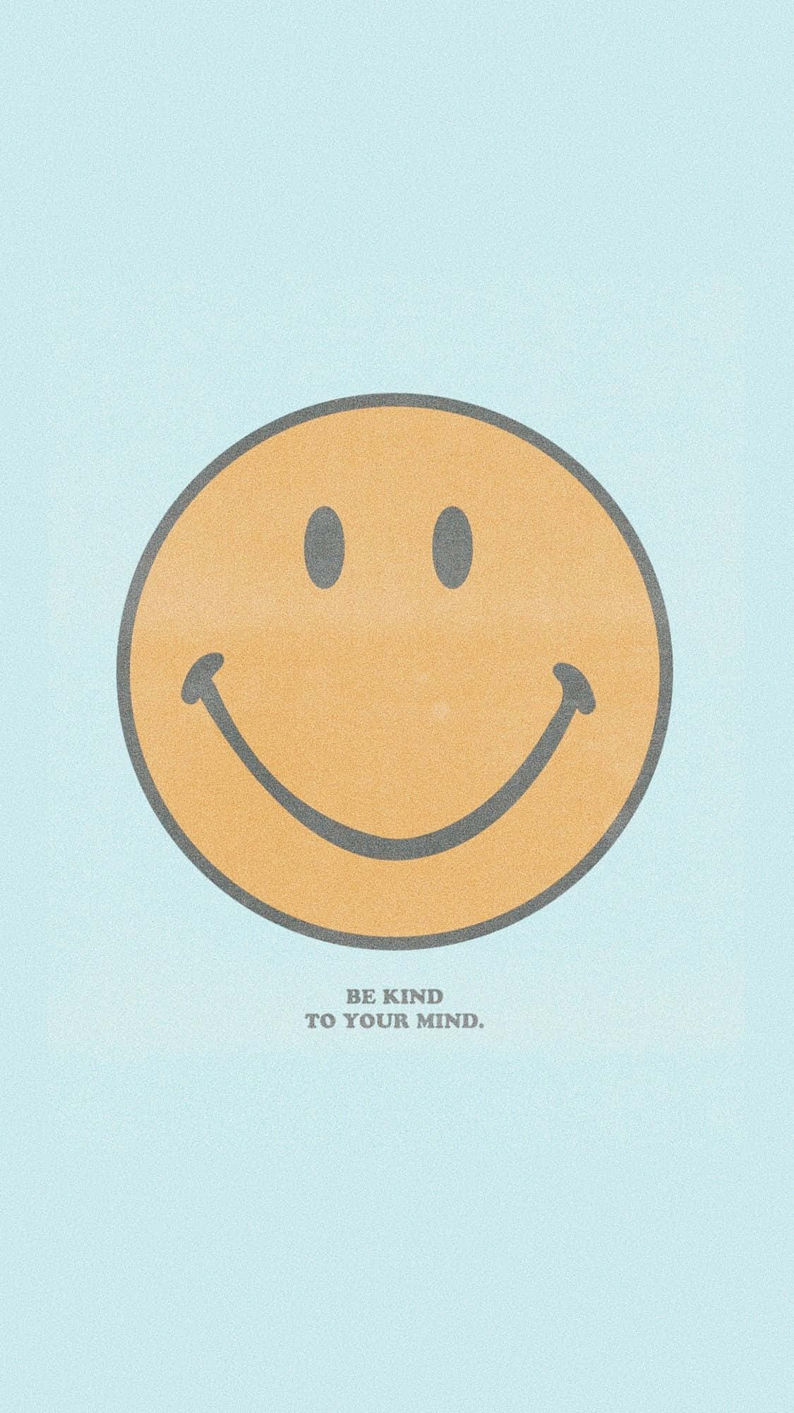 Aesthetic Smiley Face 桌布 壁紙 — 一個極簡的橙色笑臉，帶黑色輪廓，在淺藍色背景上，並有文字 be kind to your mind。