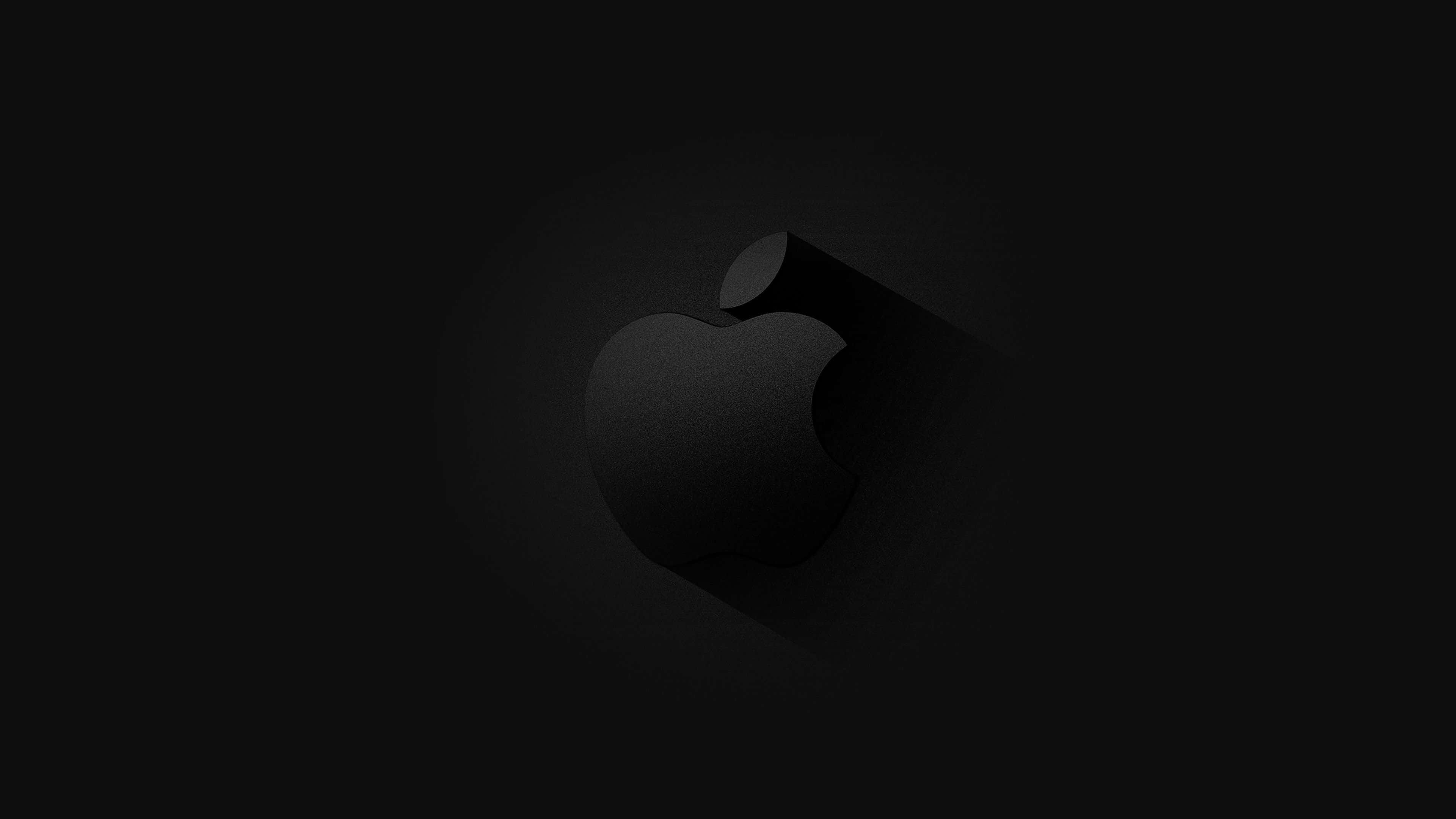 4K Apple 桌布 壁紙 — 一個極簡的黑色Apple標誌，帶有微妙的漸變和陰影效果，居中在深色背景上。
