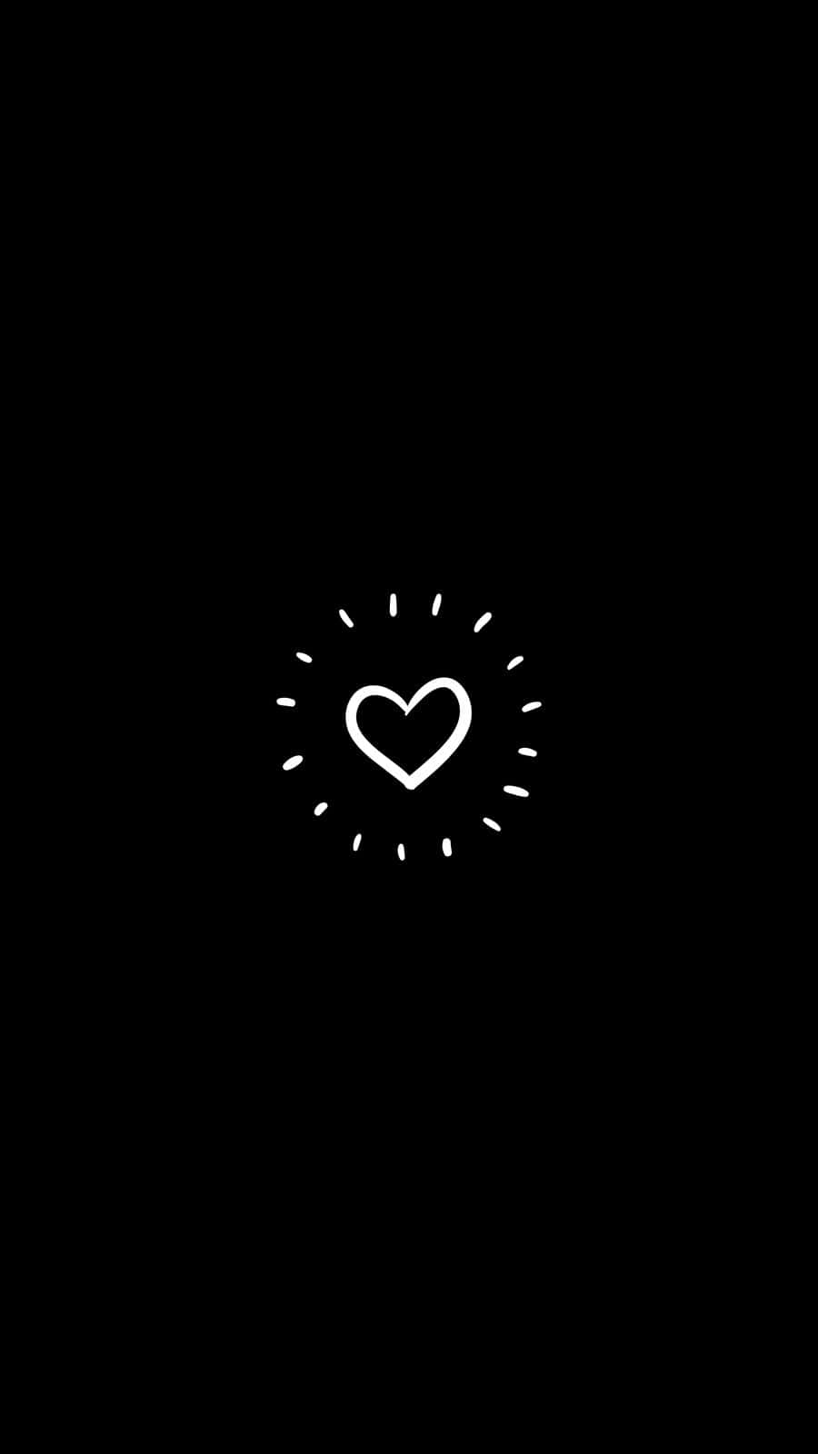 Cartoon Heart 桌布 壁紙 — 一個極簡風格的白色心形圖標，帶有放射狀虛線，居中於純黑色背景上。