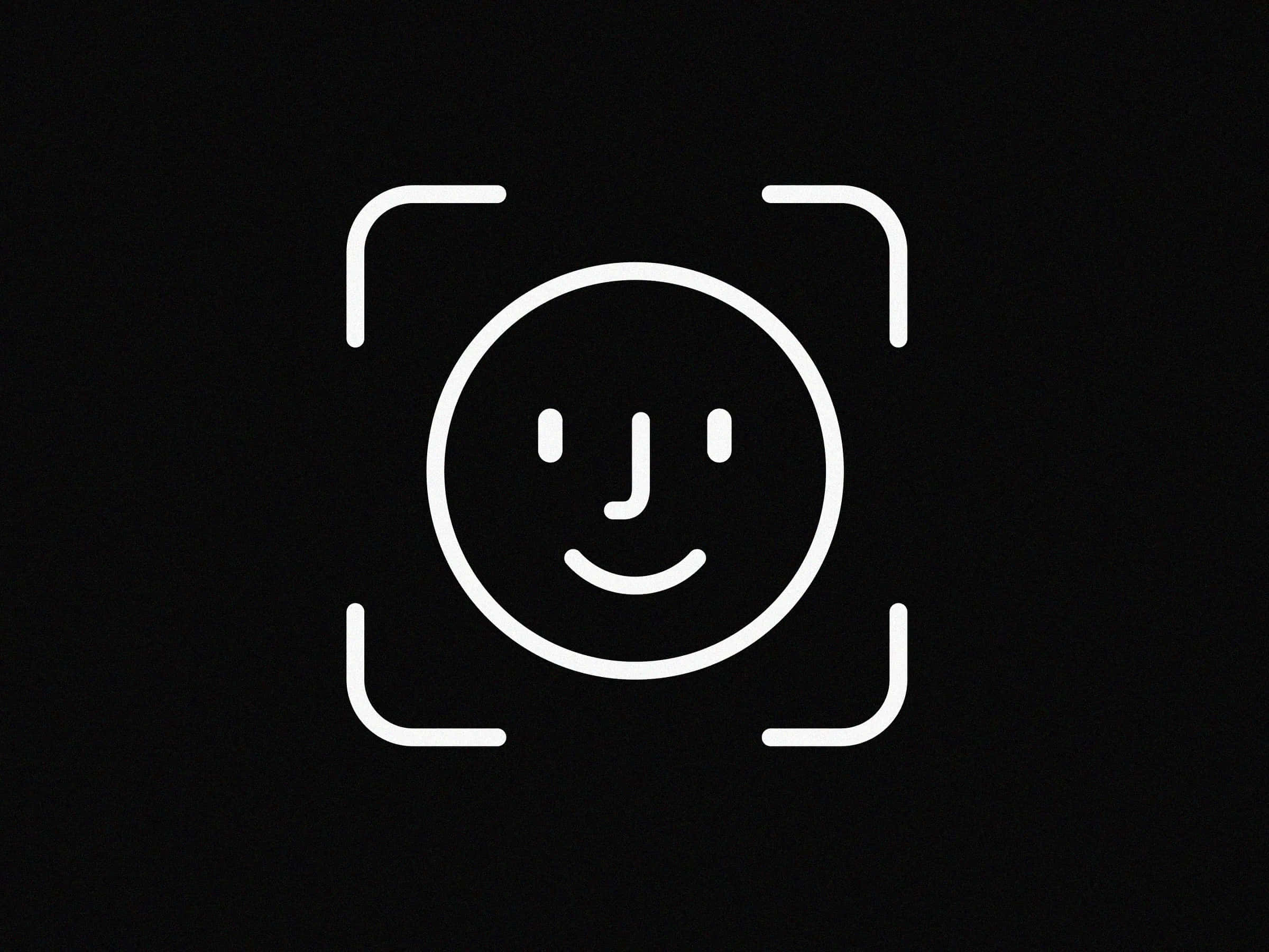 Face Id 桌布 壁紙 — 一個極簡風格的白色線條笑臉，居中於黑色背景上的相機取景器框內。