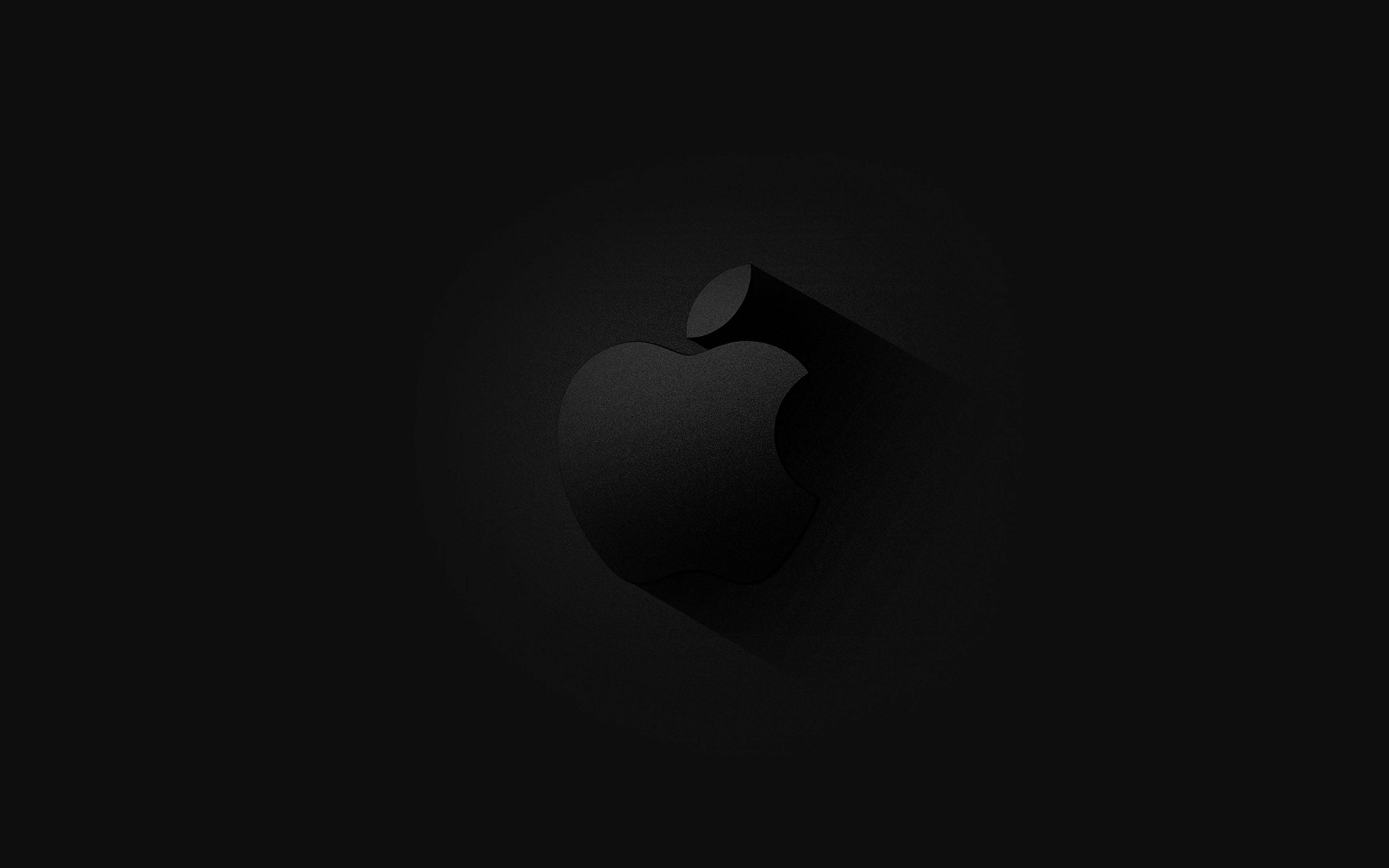 黑色動態圖 桌布 壁紙 — 一個極簡風格的黑色Apple標誌，帶有長陰影，居中在深色漸變背景上。