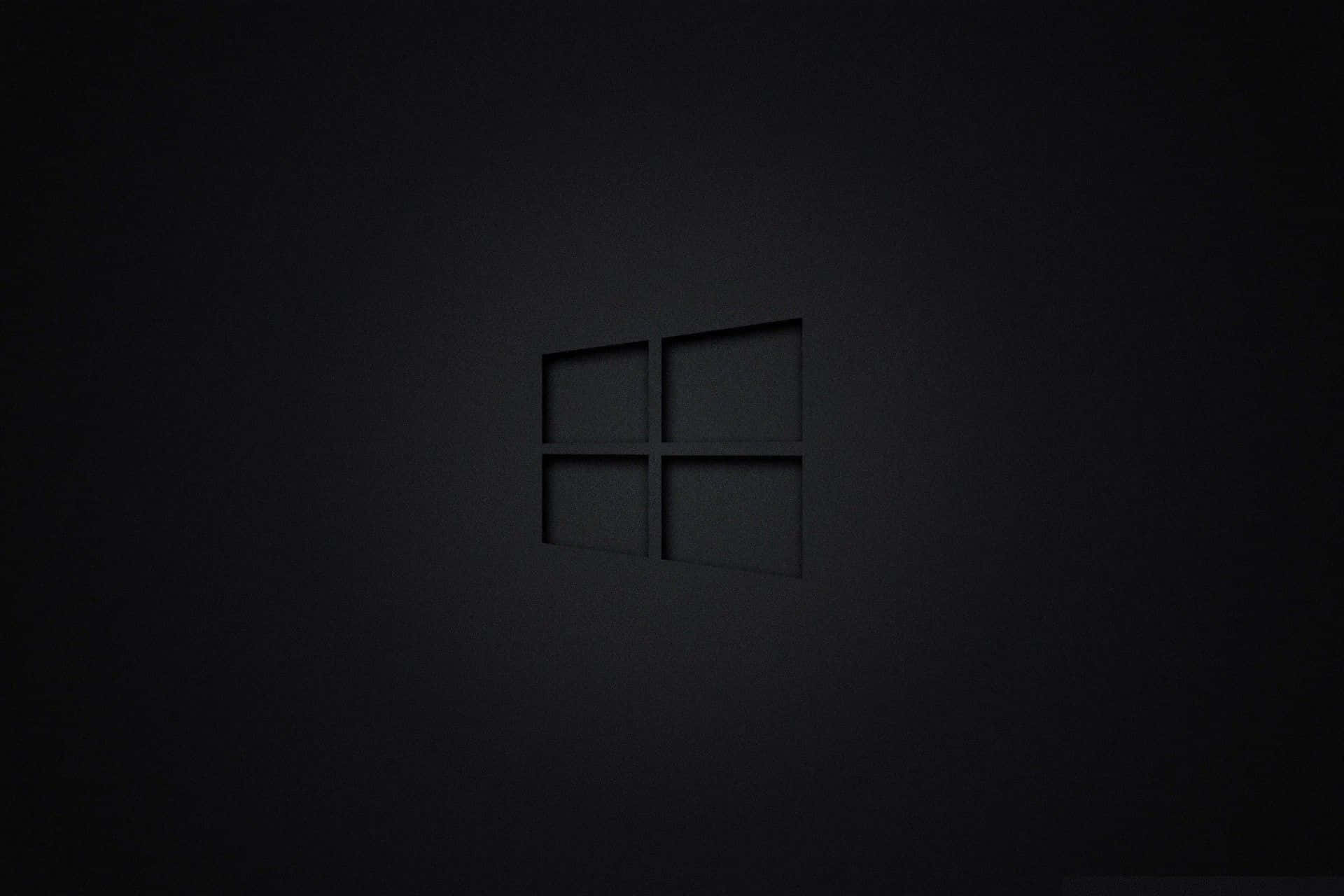 Pitch Black 桌布 壁紙 — 一個極簡風格的黑色Windows標誌，在啞光深色表面上帶有柔和陰影的微妙浮雕效果。