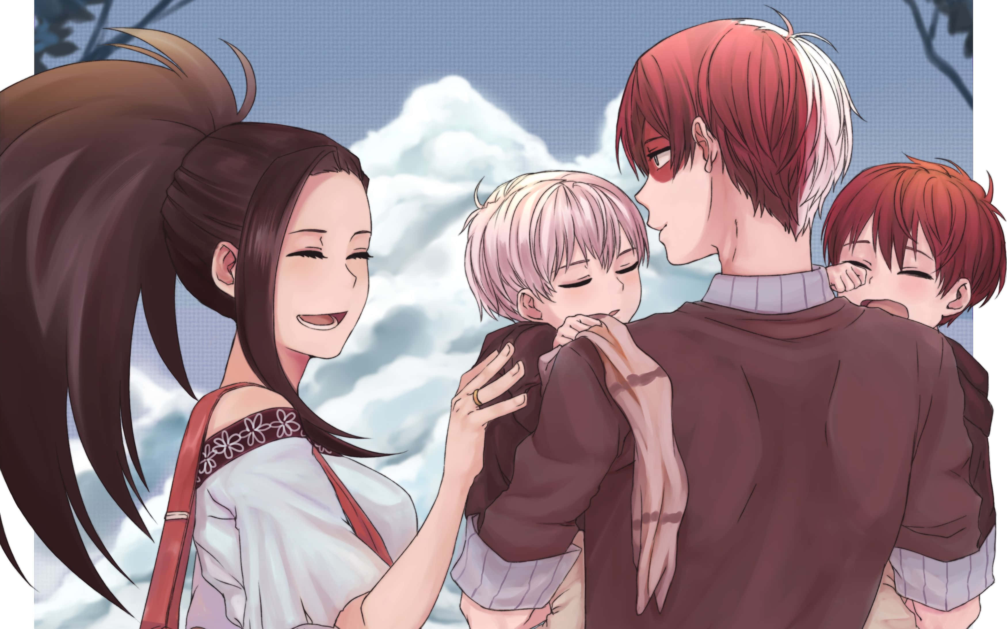 Momo Yaoyorozu 桌布 壁紙 — 一個溫暖的動畫家庭時刻，母親微笑著，丈夫抱著兩個孩子，背景是白雪皚皚的山脈。