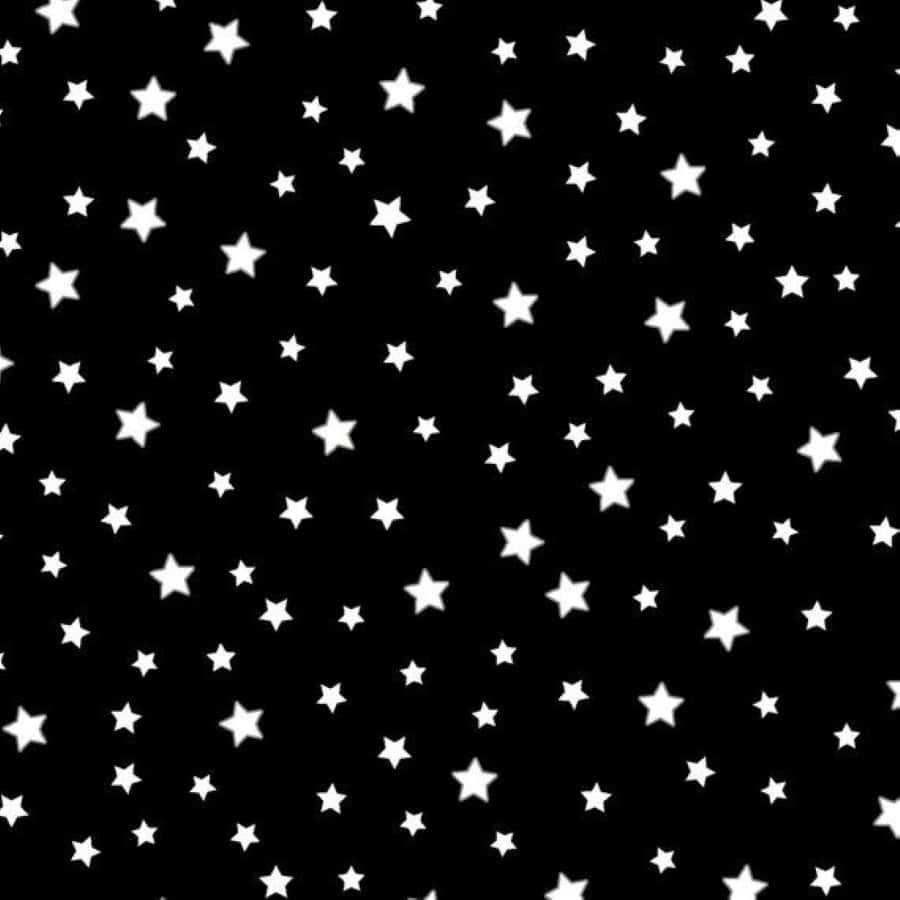 Black And White Star 桌布 壁紙 — 一個無縫圖案，白色星星散落在純黑色背景上。