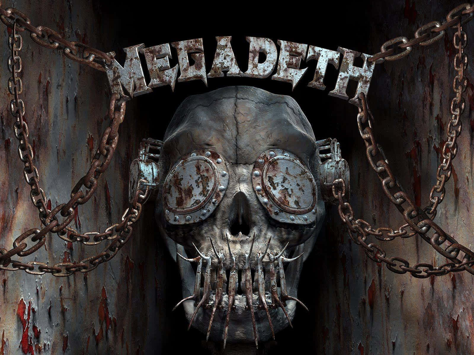 Heavy Metal 桌布 壁紙 — 一個生鏽的金屬頭骨，帶有尖刺牙齒和護目鏡，懸掛在樂隊名稱 Megadeth 下方，由沉重的鏈條框住，靠在腐蝕的牆壁上。