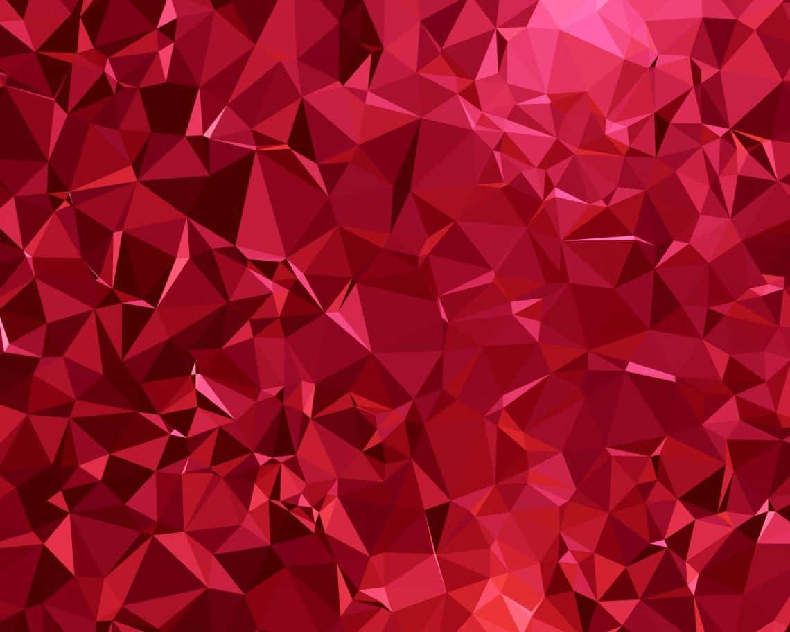 Ruby 桌布 壁紙 — 一個由相互交錯的紅色三角形組成的充滿活力的抽象圖案，營造出動態的低多邊形紋理。