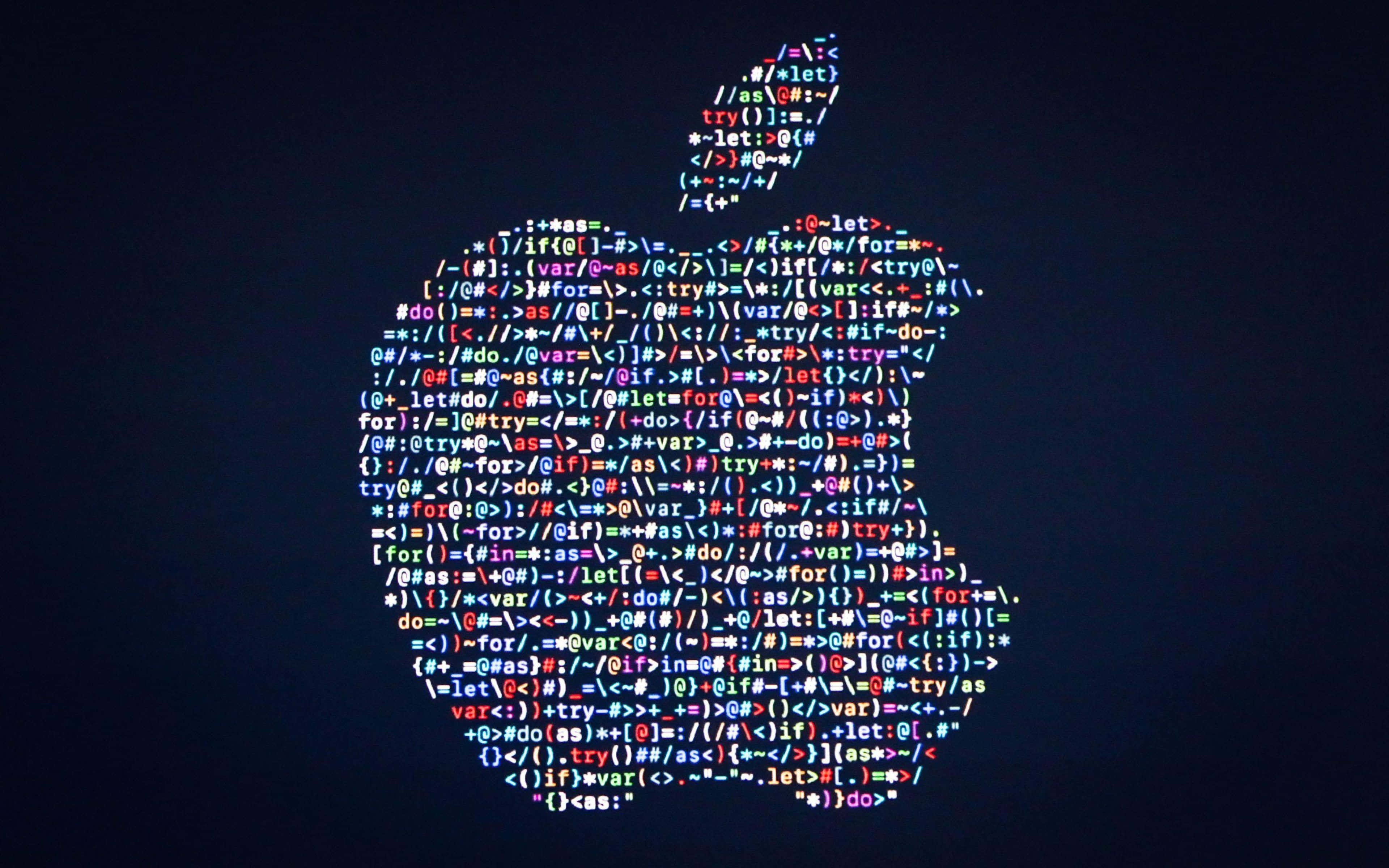 4K Apple 桌布 壁紙 — 一個發光的Apple標誌，由色彩繽紛的串聯代碼在深色背景上形成。