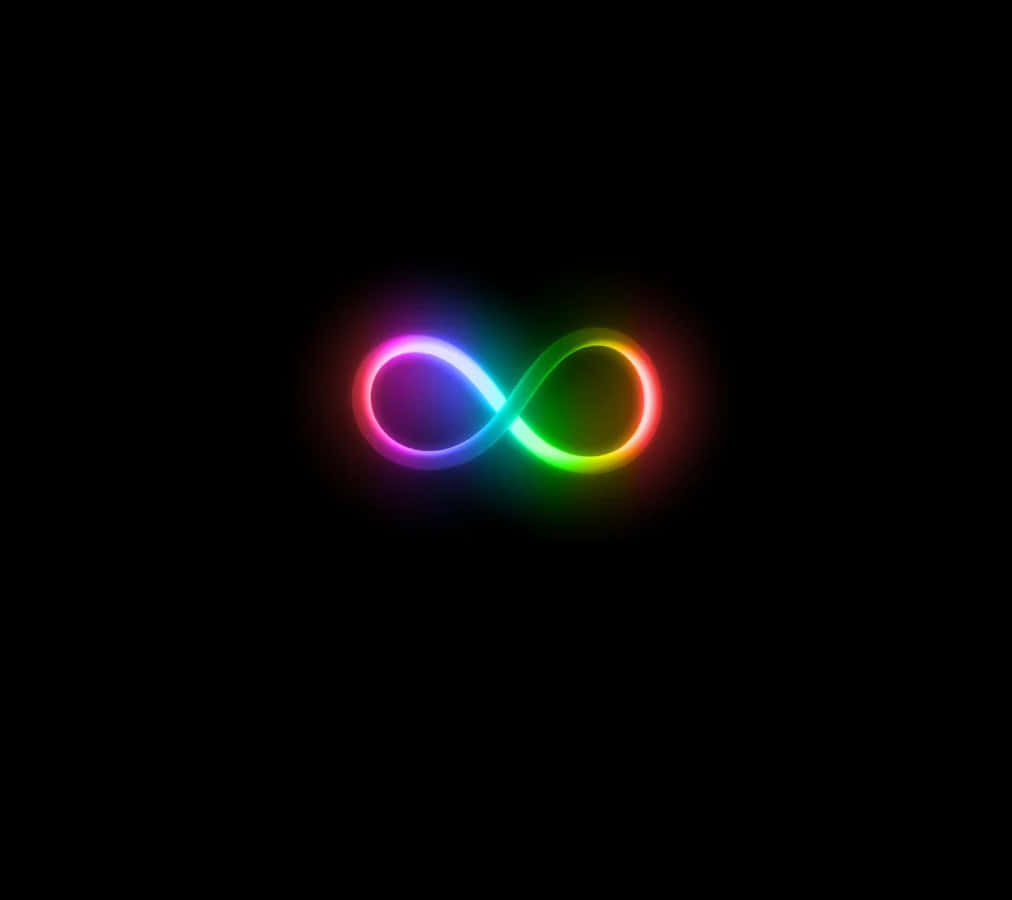 Dark Infinity 桌布 壁紙 — 一個發光的彩虹無限符號在純黑色背景上輕輕脈動。