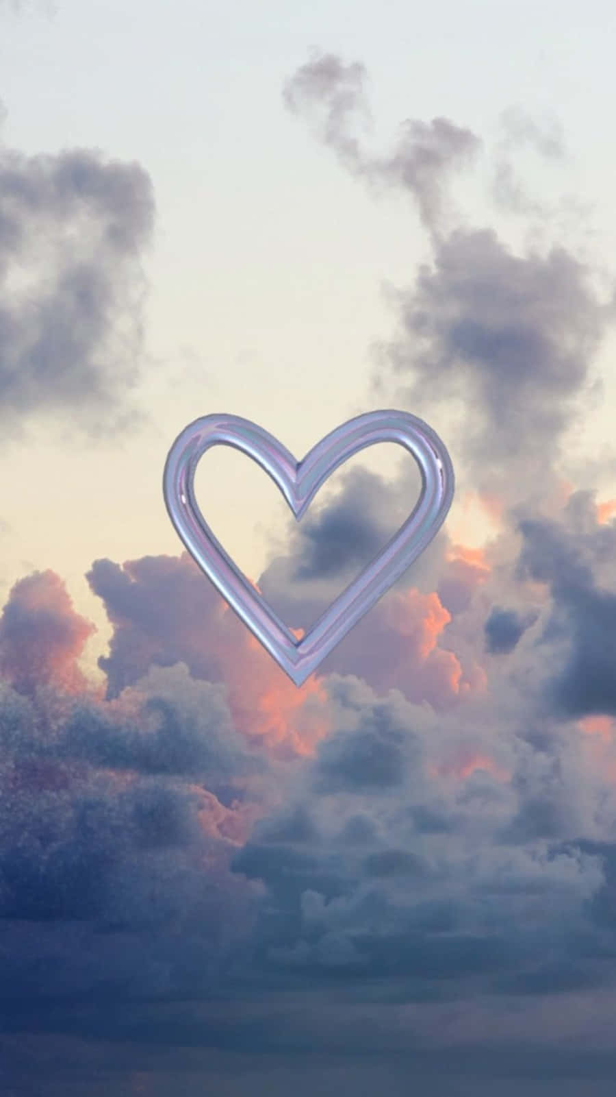 Heart Shape 桌布 壁紙 — 一個發光的愛心形狀框架，寧靜地漂浮在塗有柔和粉紅、紫色和藍色的暮色天空中。
