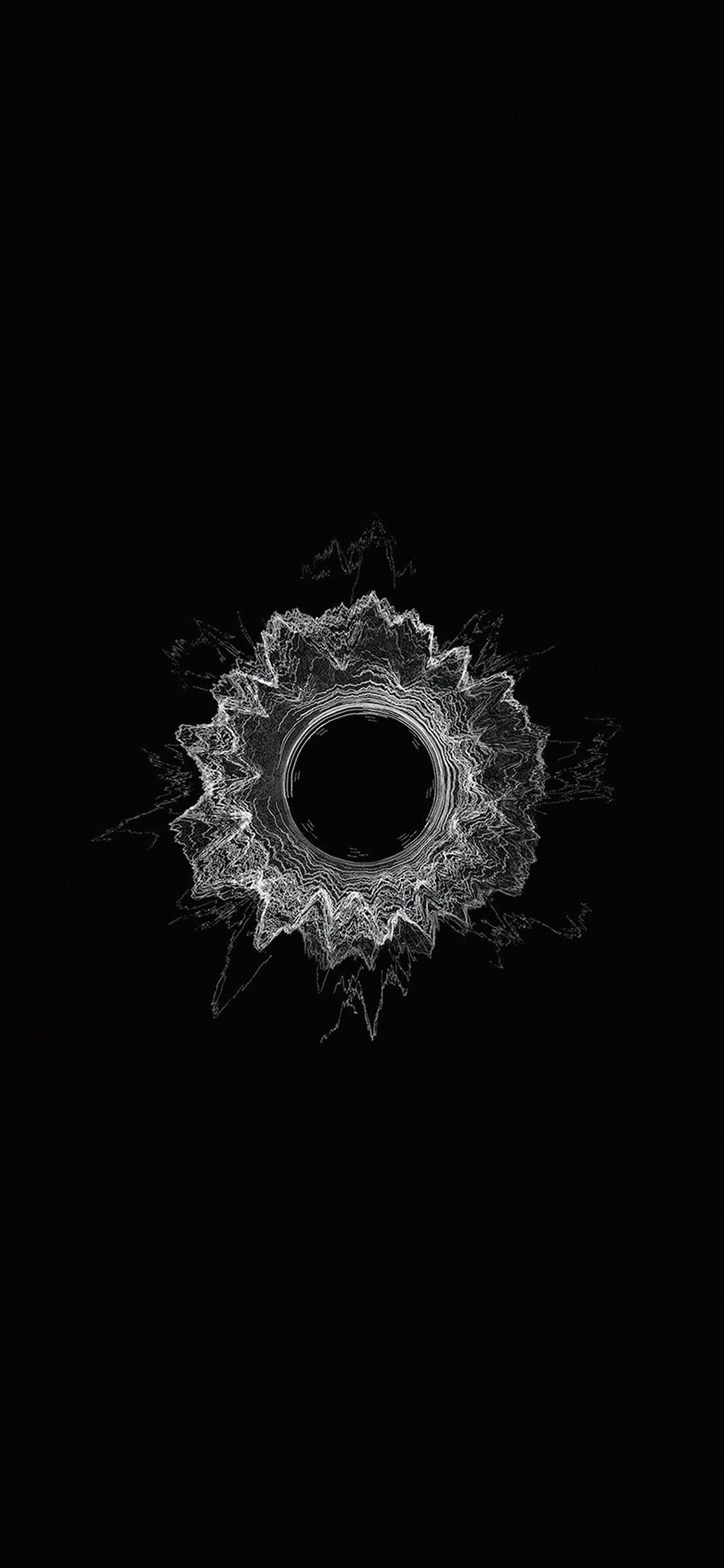 Minimalist Pattern 桌布 壁紙 — 一個發光的白色分形曼陀羅從中央虛空向純黑色背景輻射。